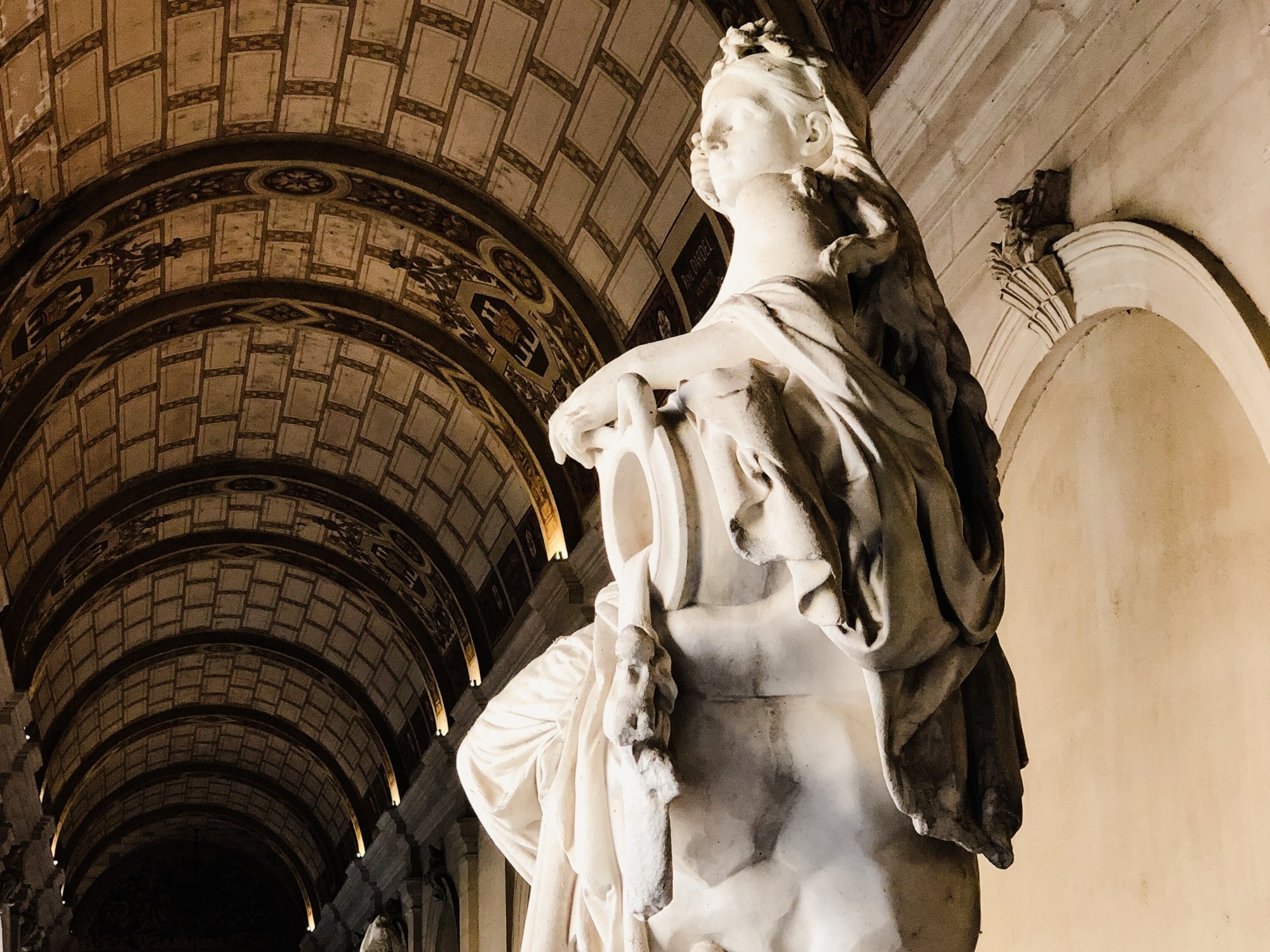 Statue of woman inside a building. 