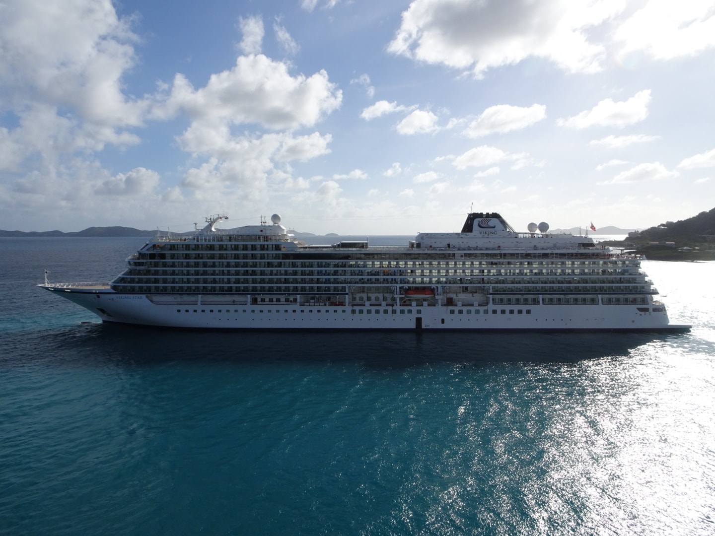 a cruise ship sailing on blue water 