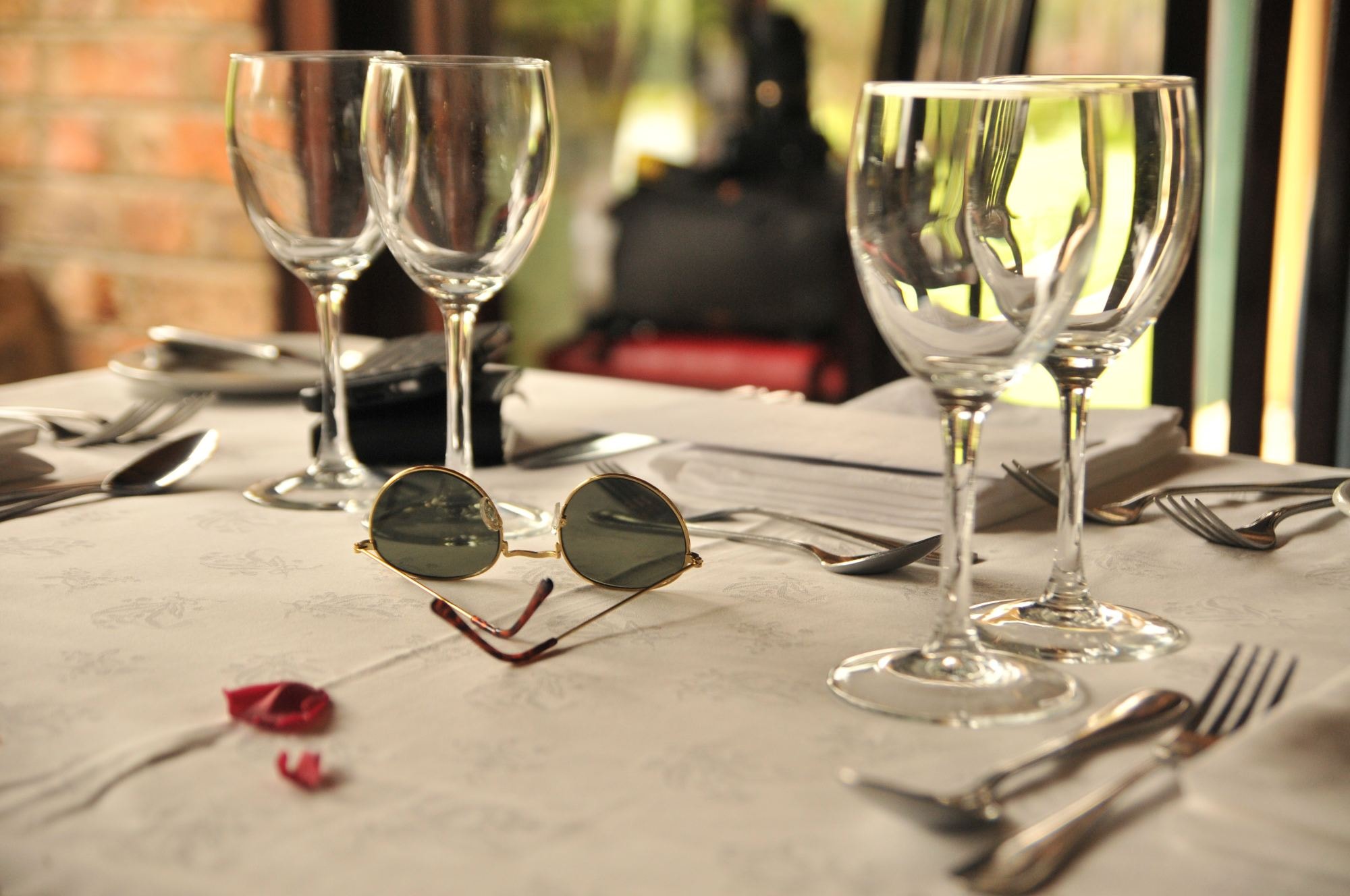 Four wine glasses on a table. 