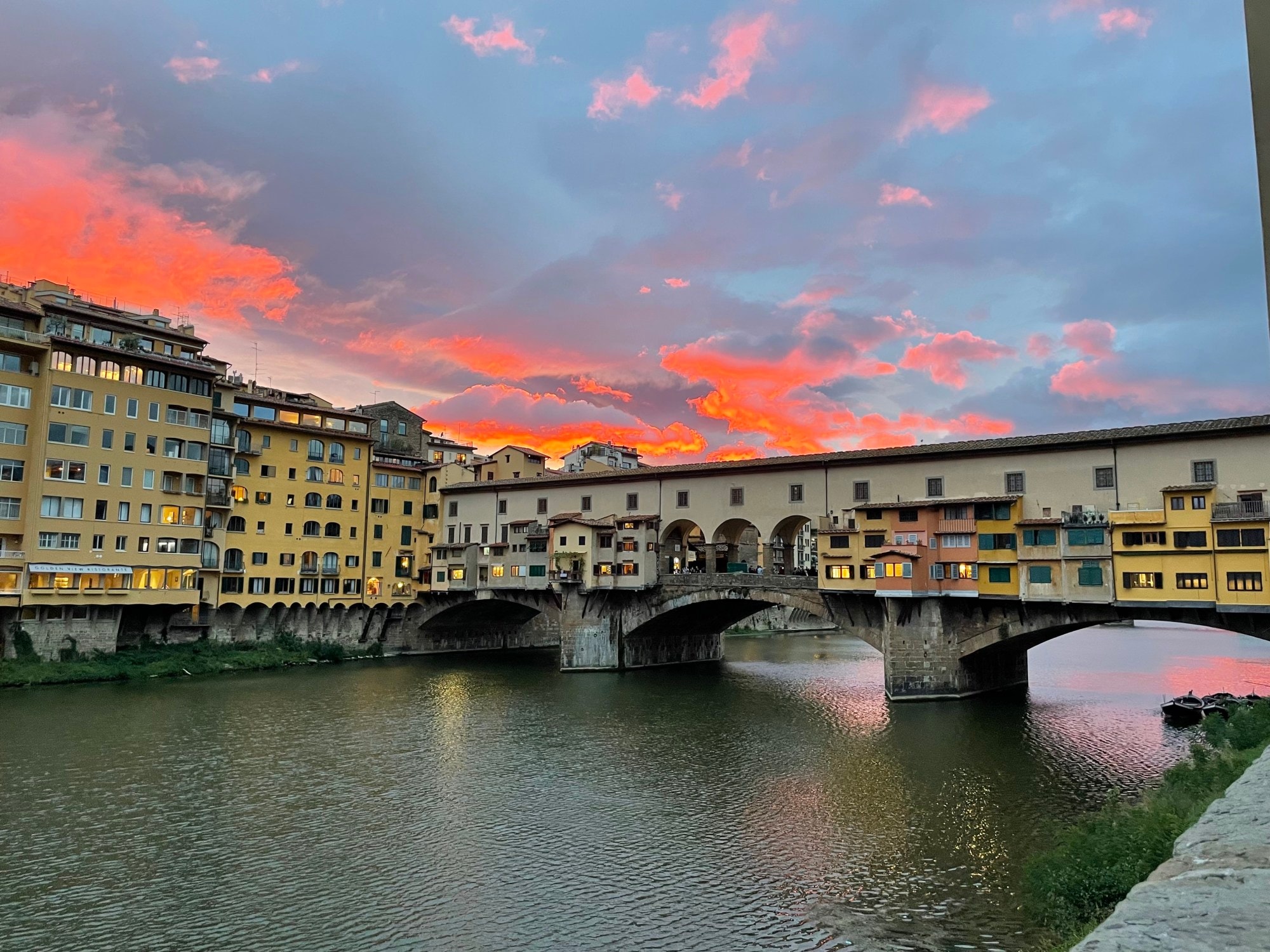 A city canal with golden hour sky.