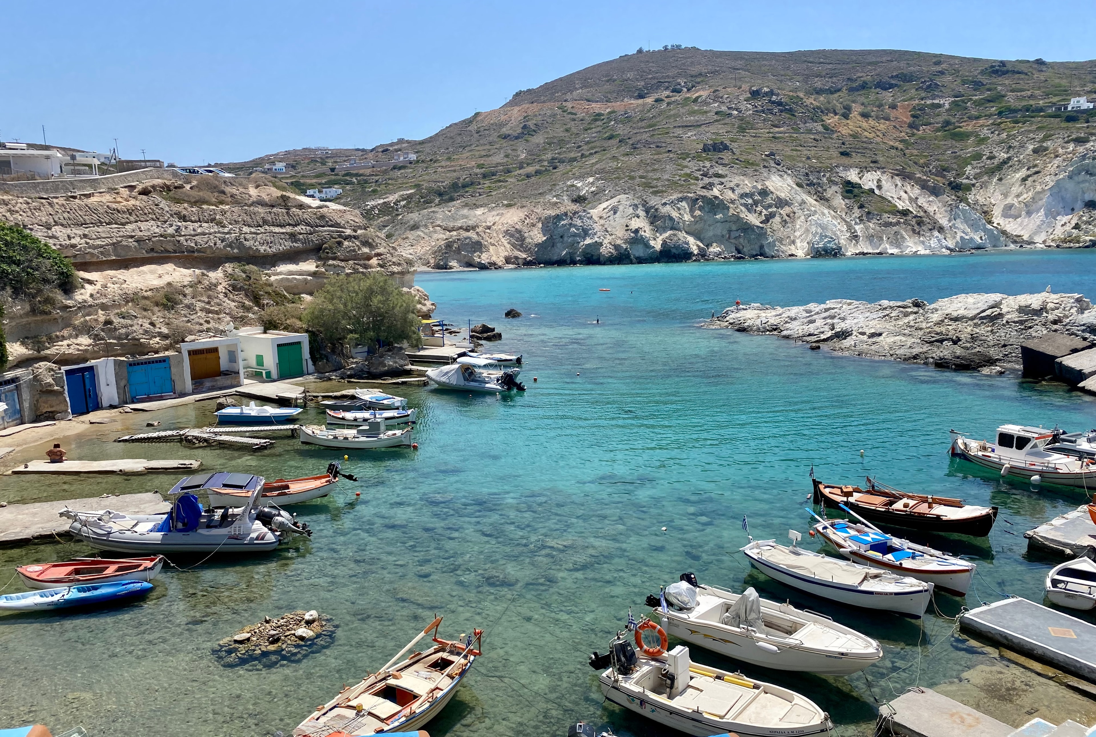 Boats anchored in sea shore