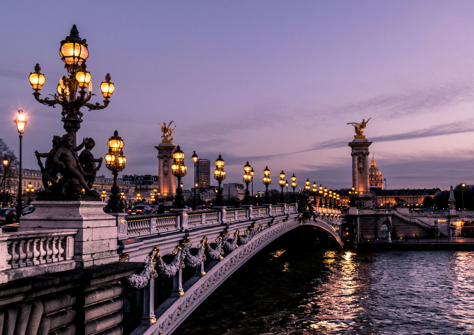 A bridge over river during evening. 