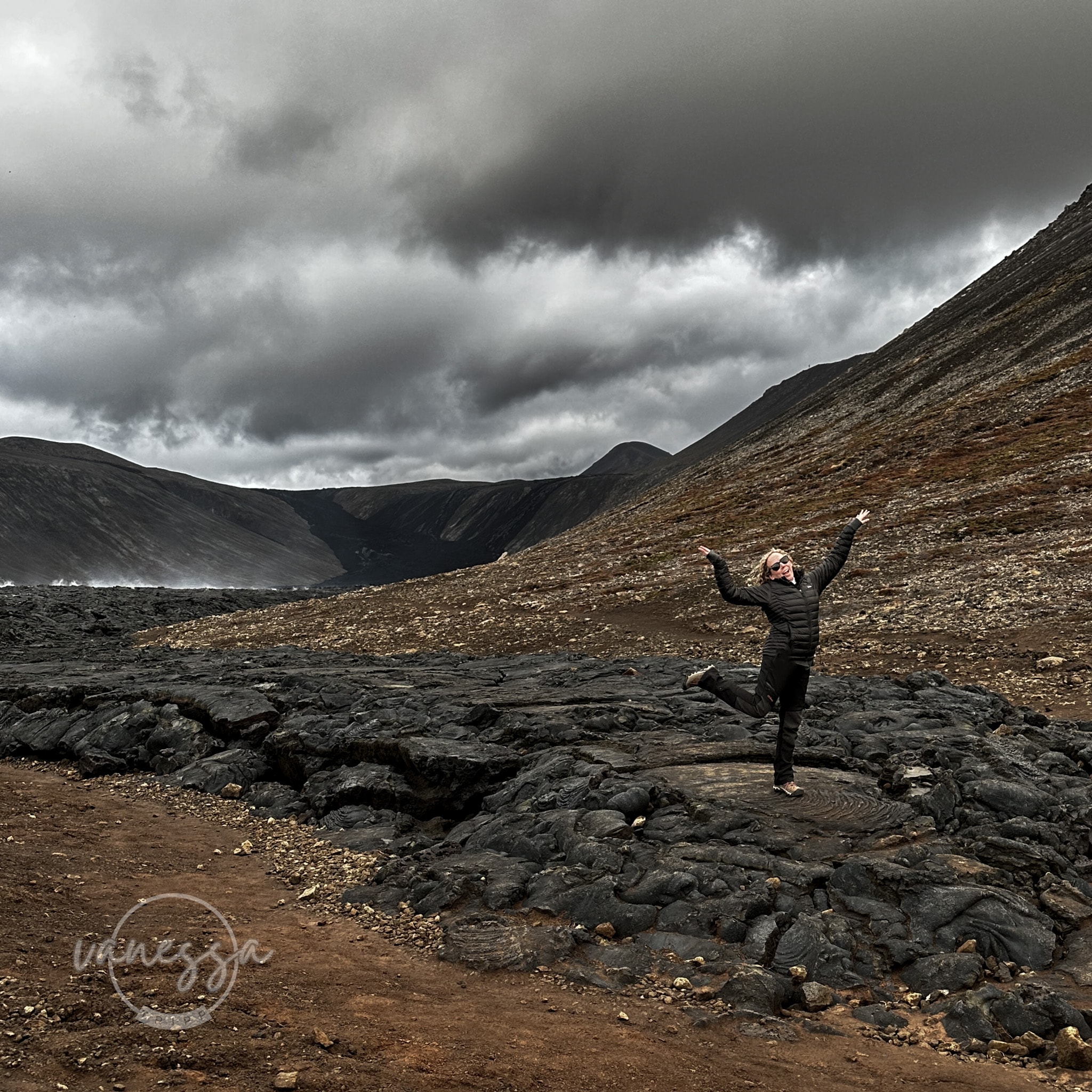 Advisor posing for an image a nature setting on a cloudy day.