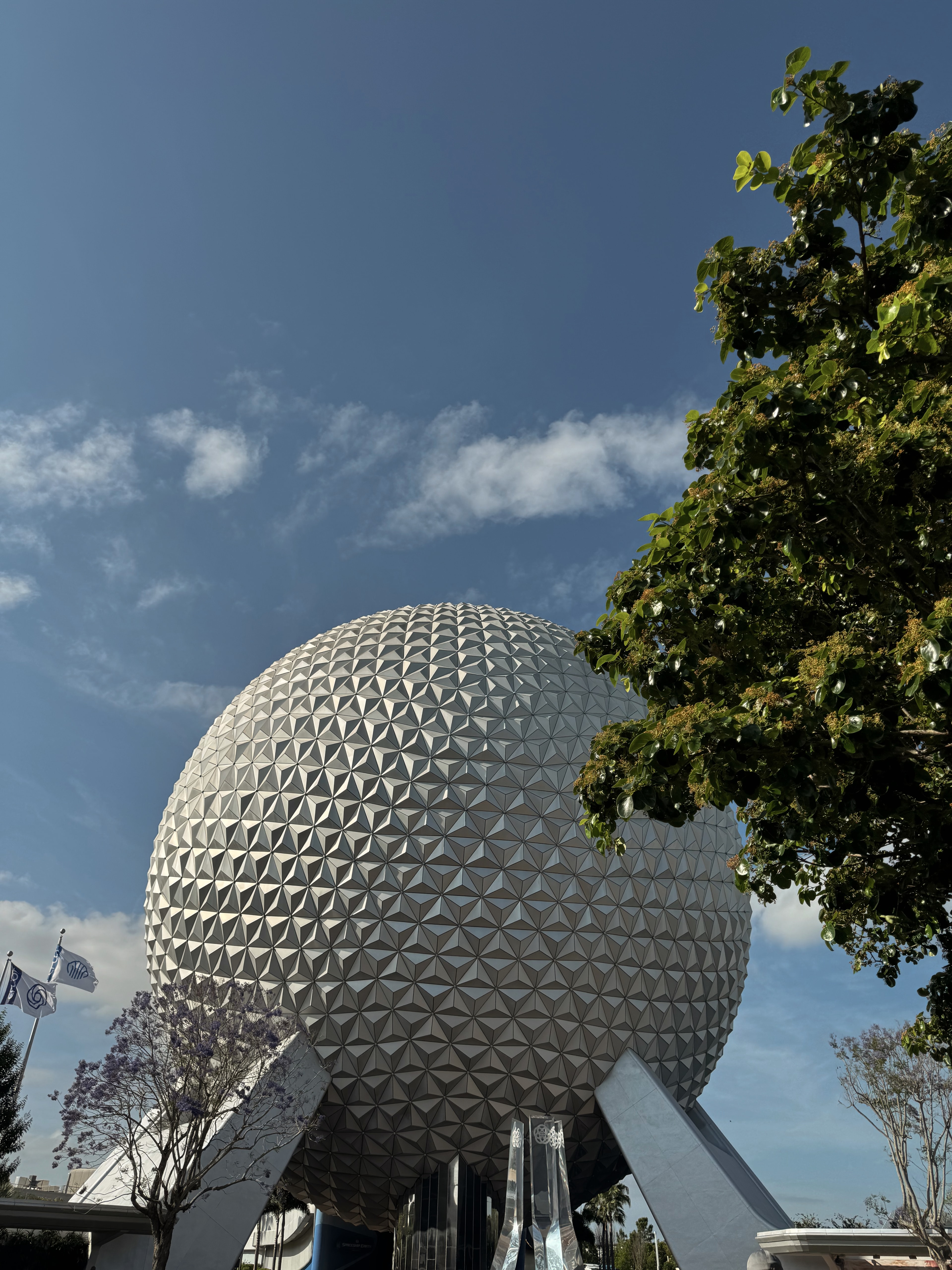 Image of a large white sphere-shaped building under blue skies