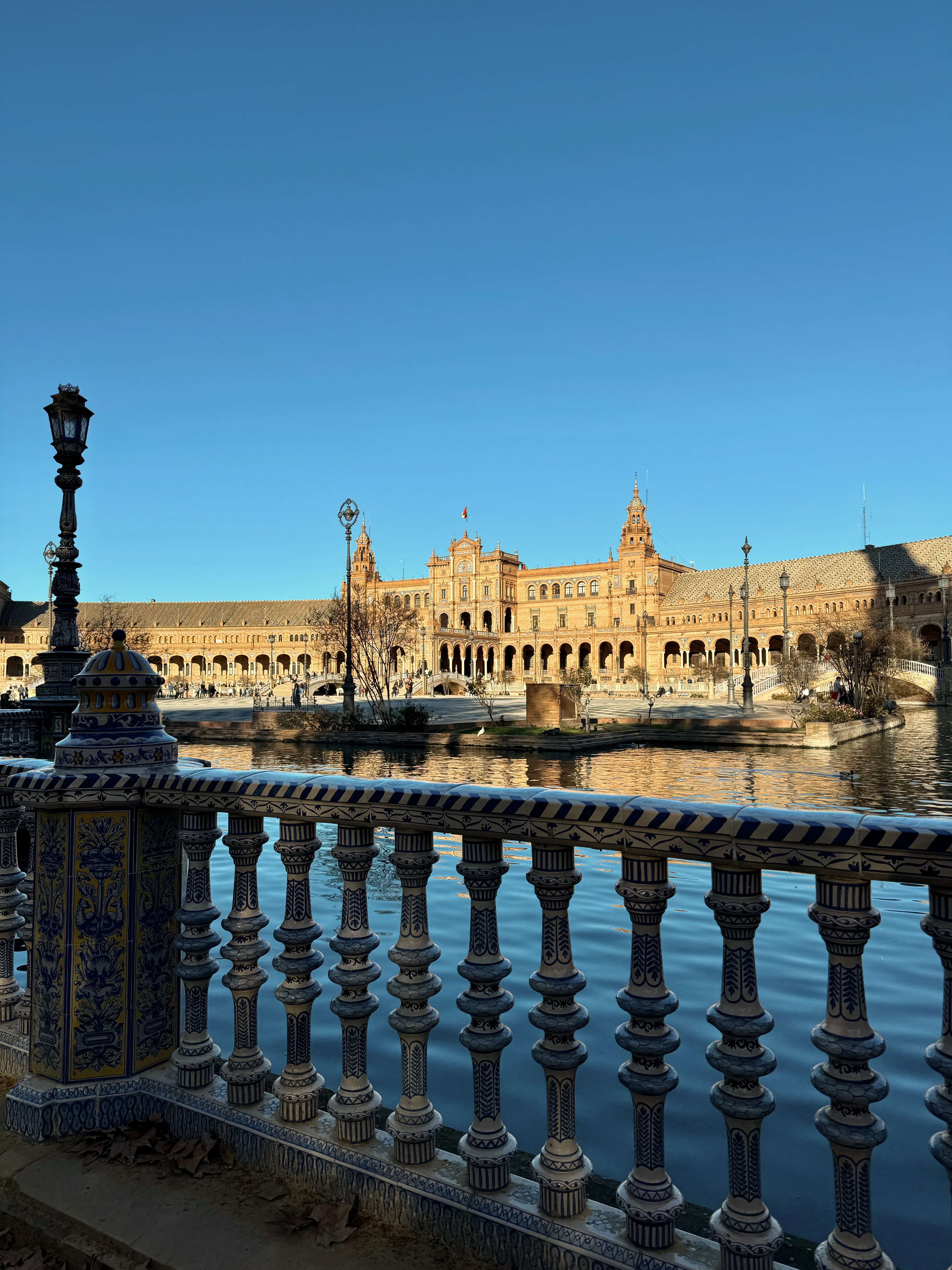 Beautiful view of the Plaza de Espana in Seville as seen from a bridge on a sunny day