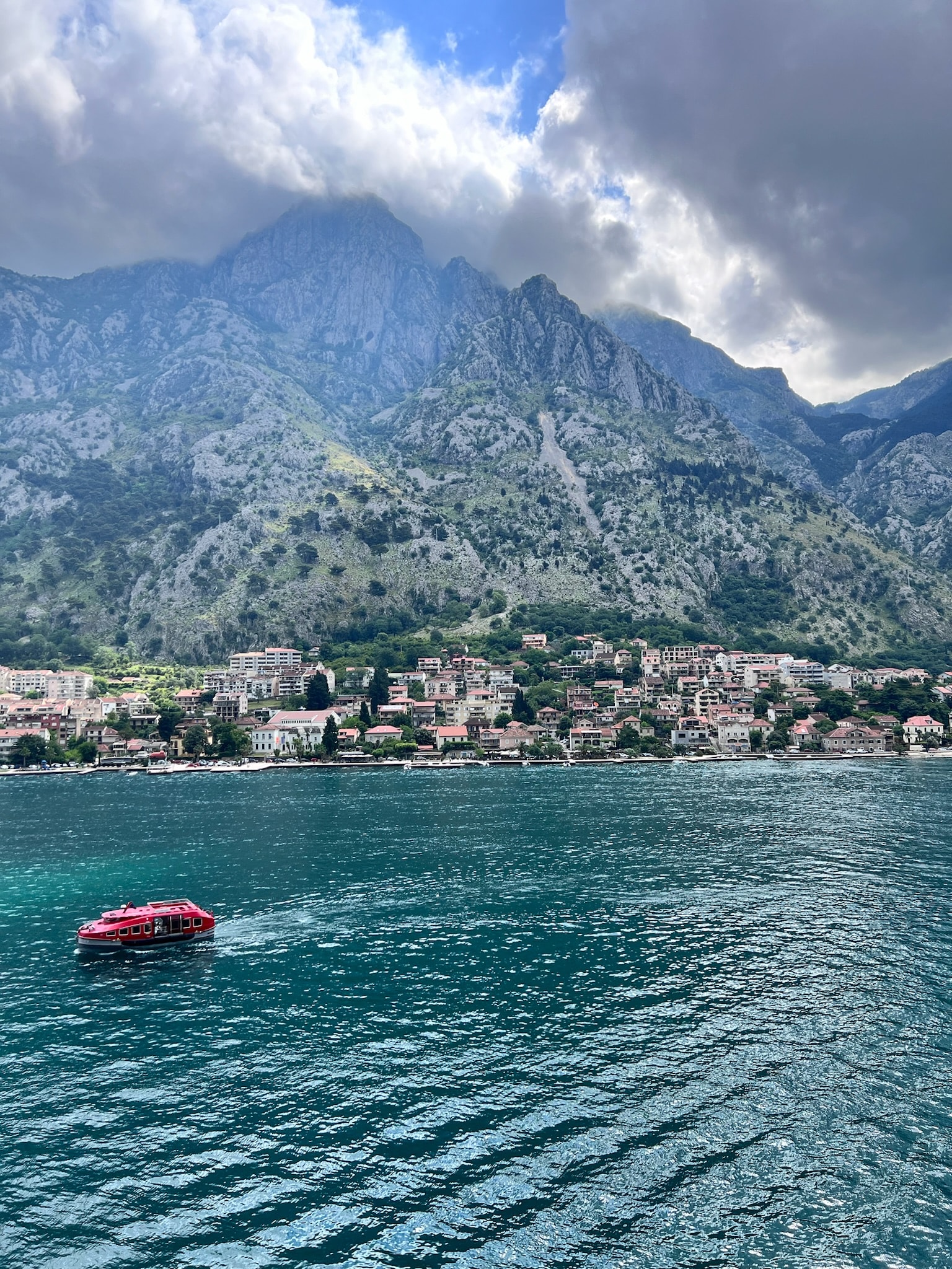 Photo of a lake with mountains in the background during the daytime.