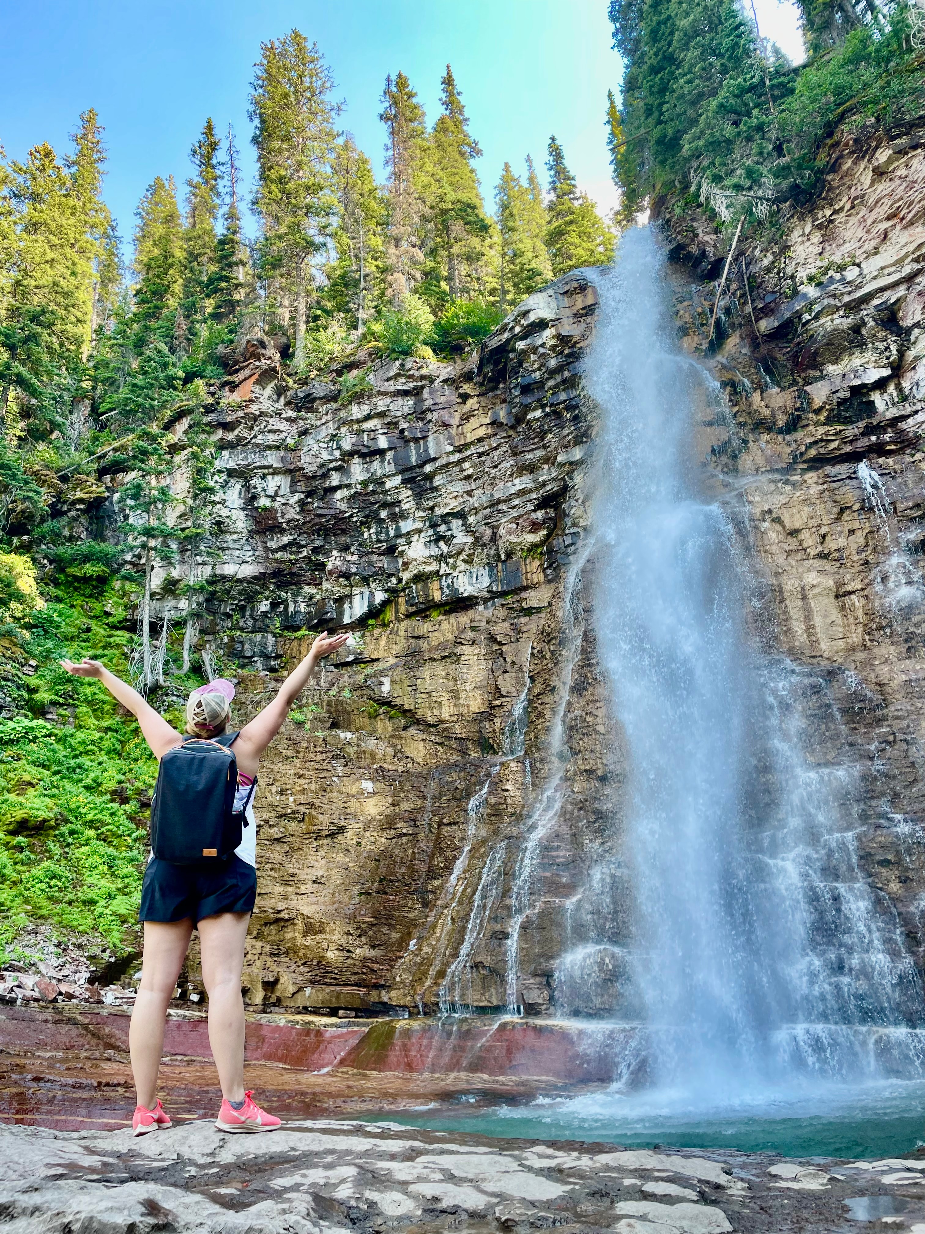 Enjoying waterfall views on a sunny day.