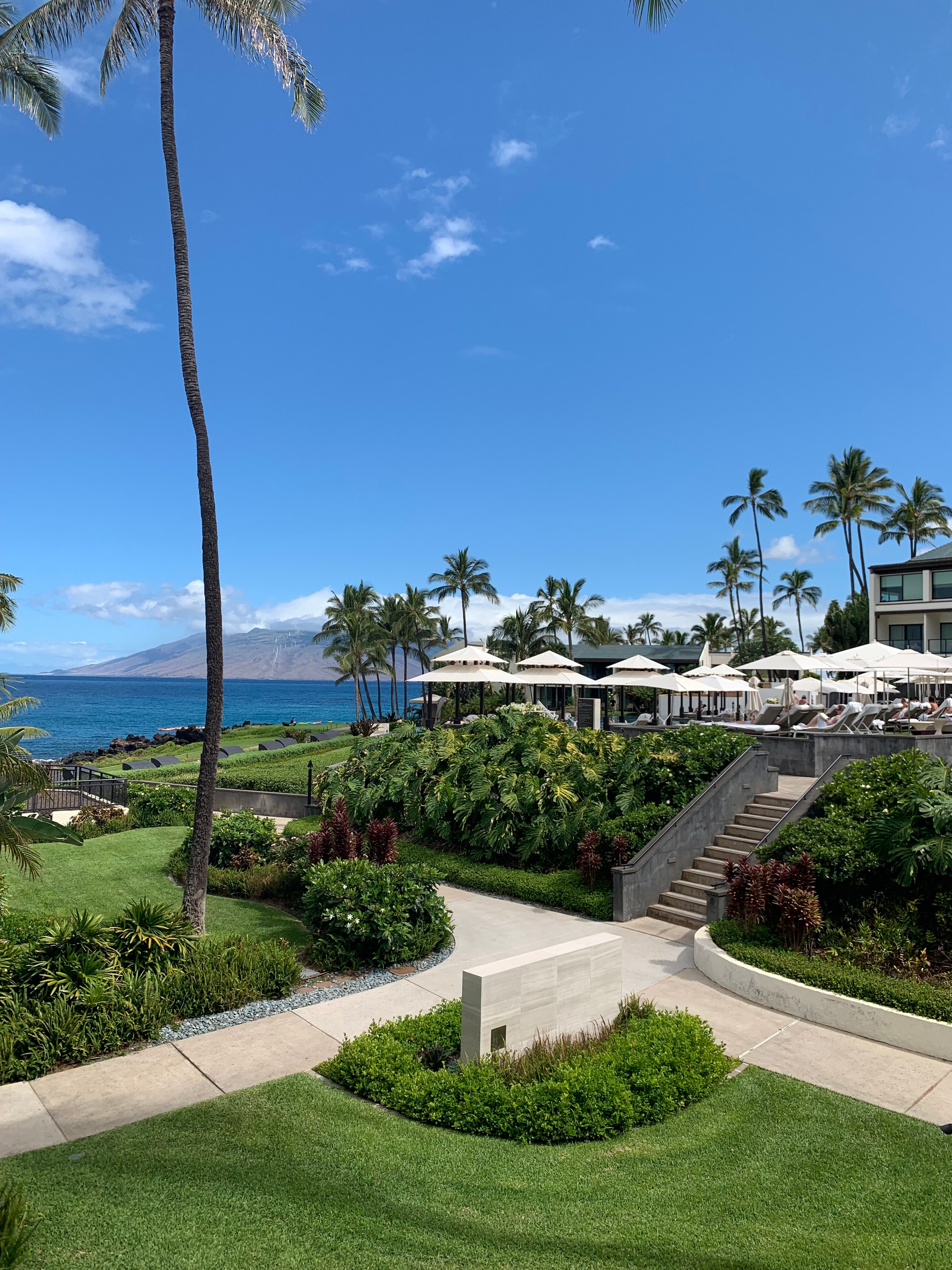 A scenic view from the resort's lawn overlooking the ocean.