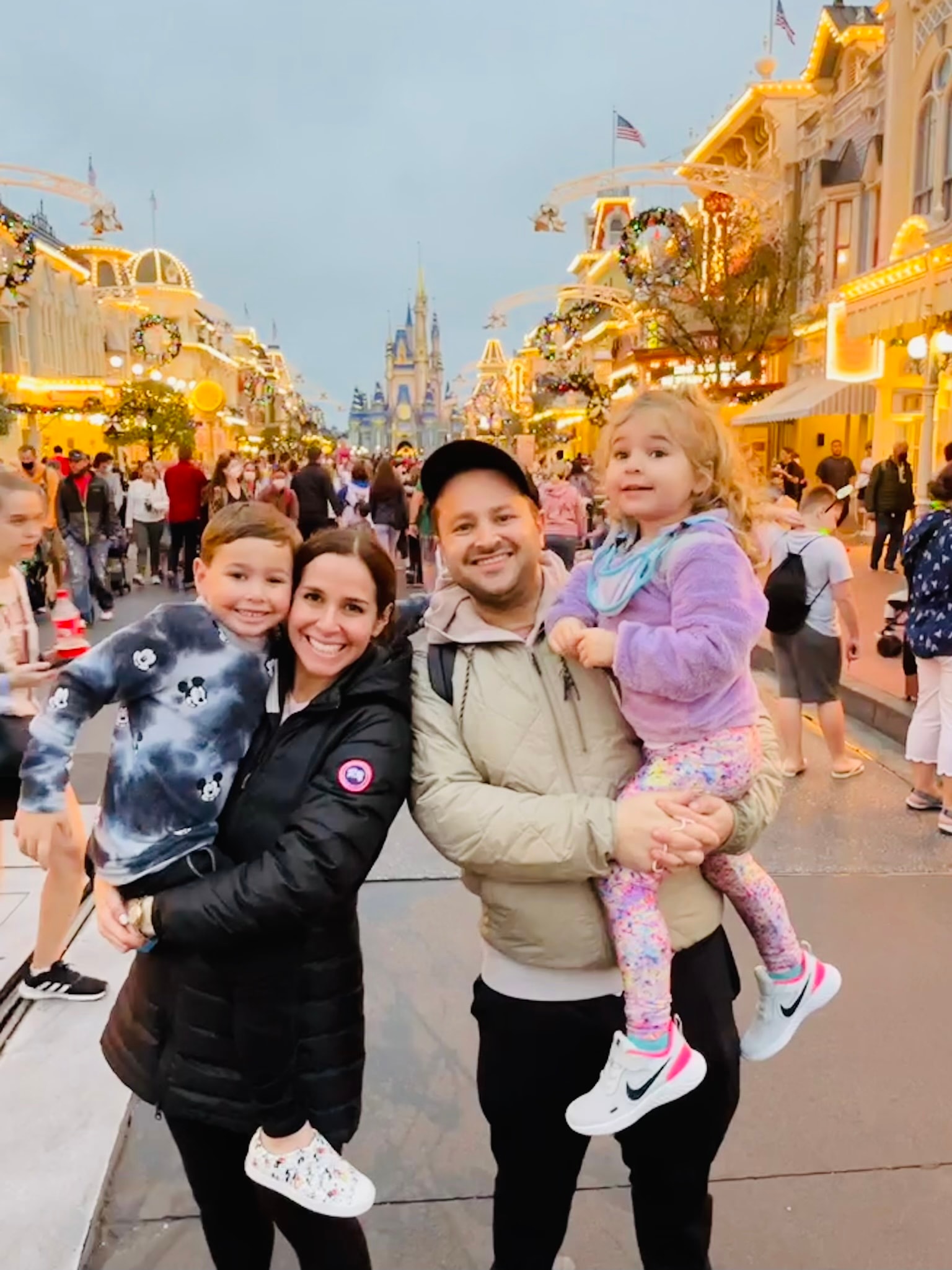 A family posing at Disneyland.