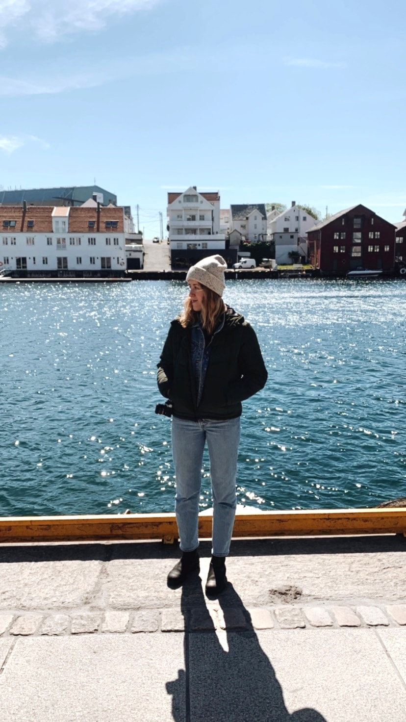 Advisor standing on a waterway on a sunny day. 