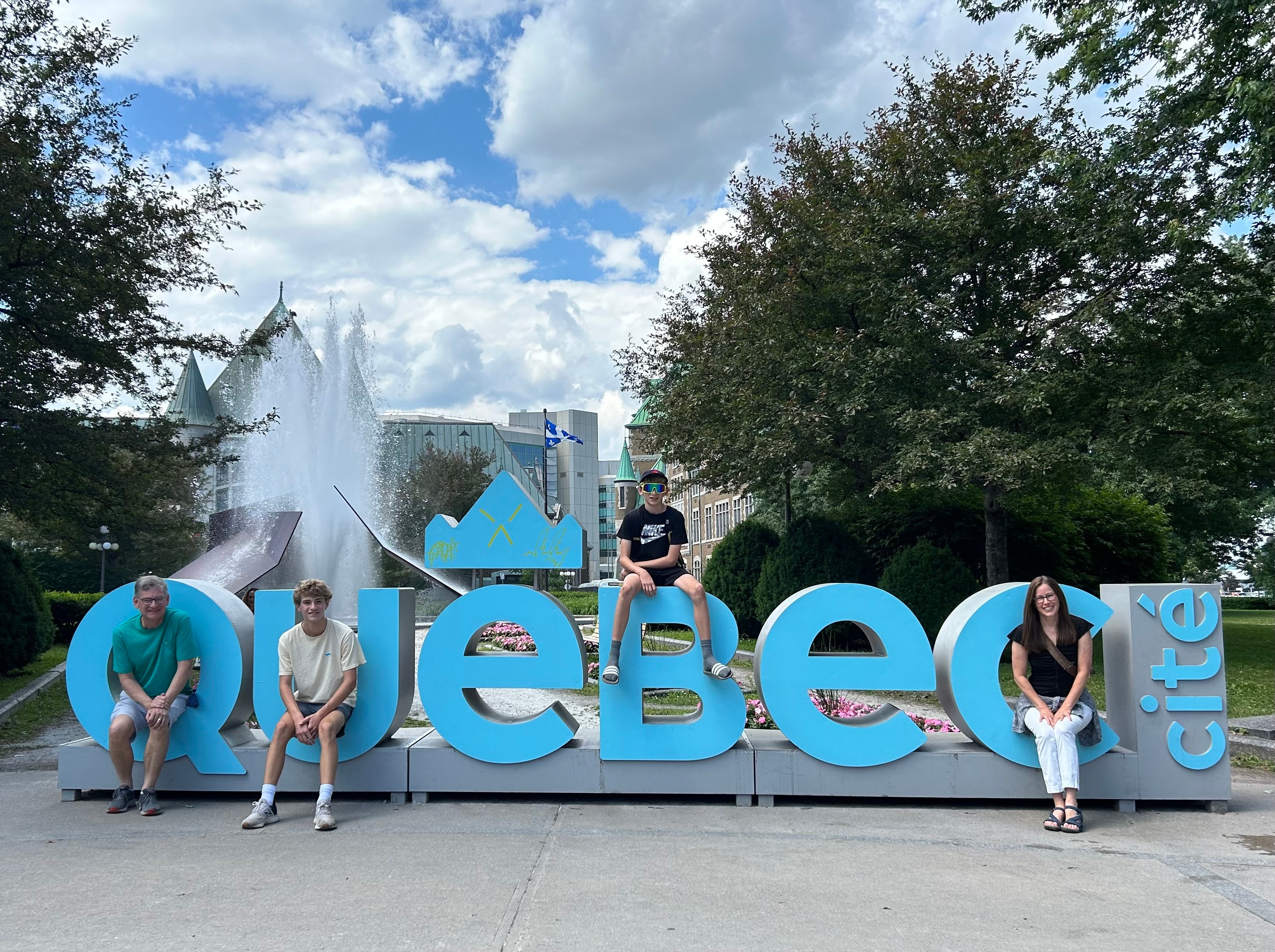 A family posing during the daytime.