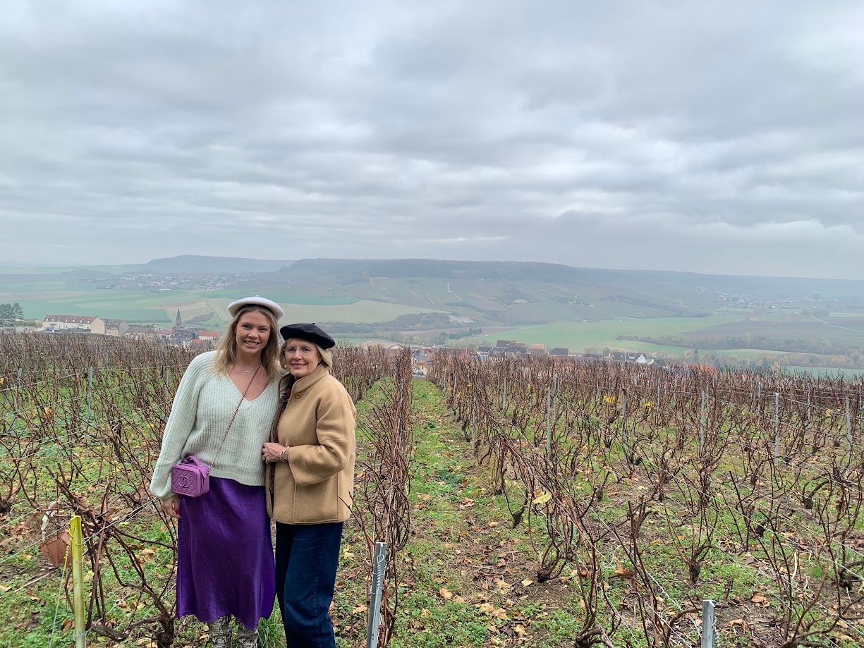 Advisor and her mother standing in a vineyard on a cloudy day