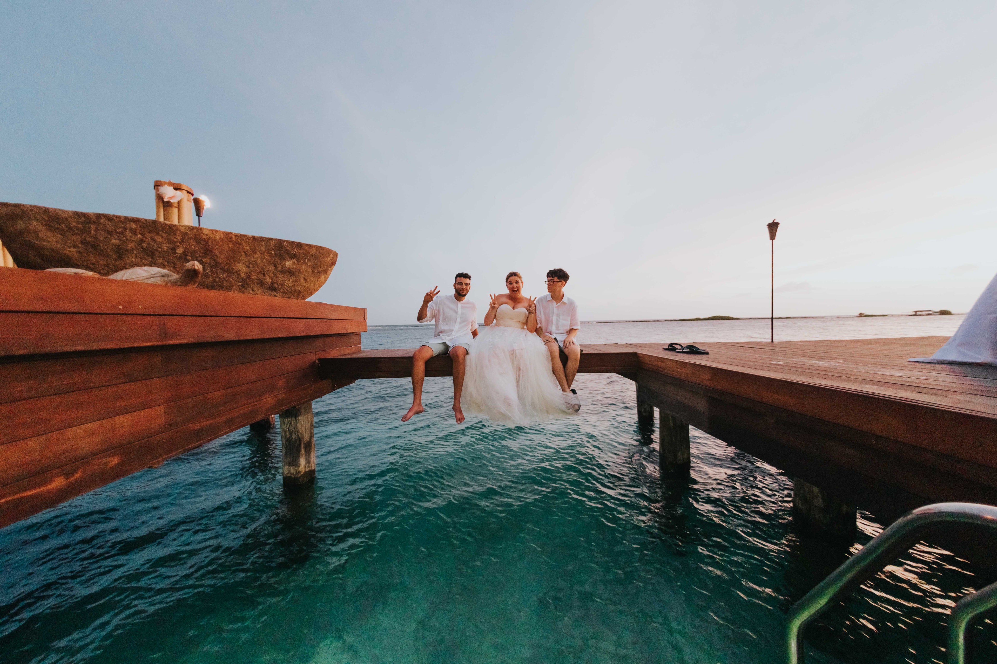 Sitting over clear blue water.