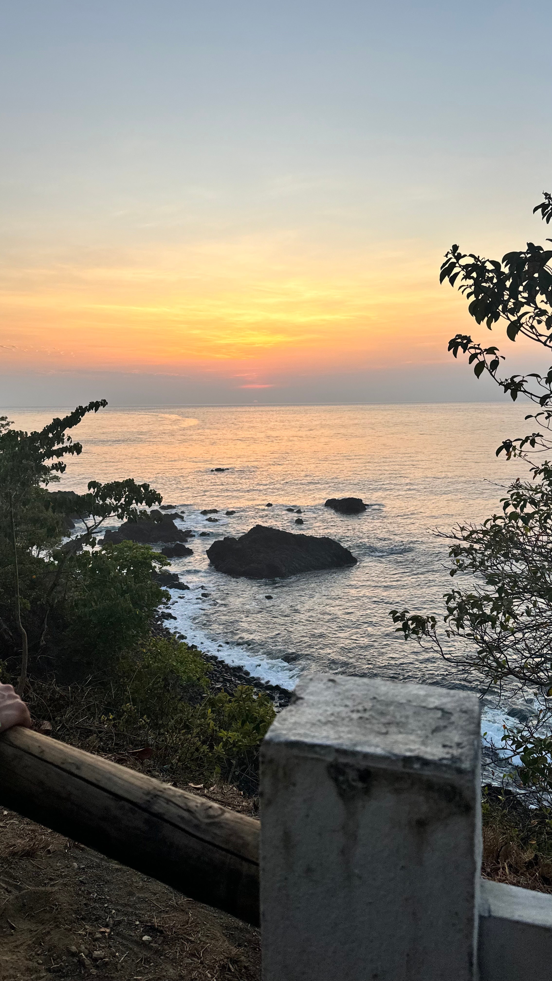 View of a beautiful small beach at sunset