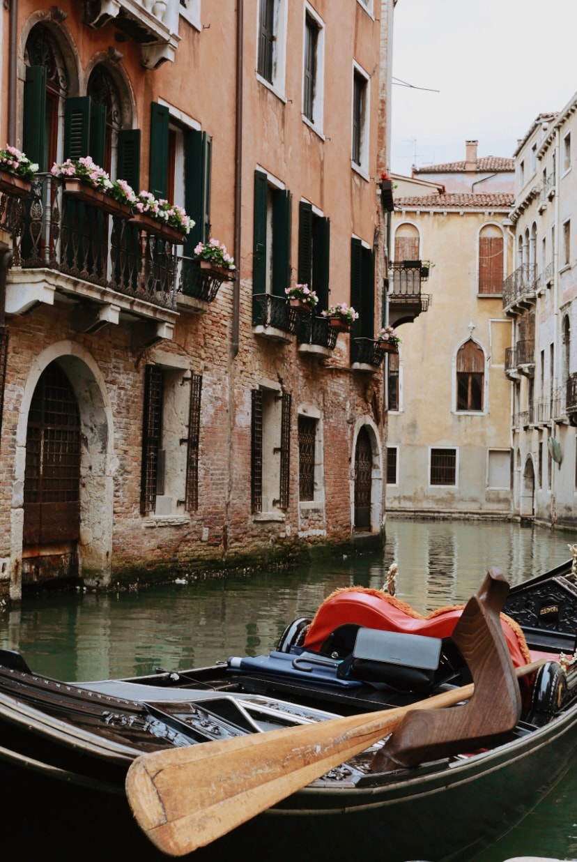 A canal in Venice during the day. 