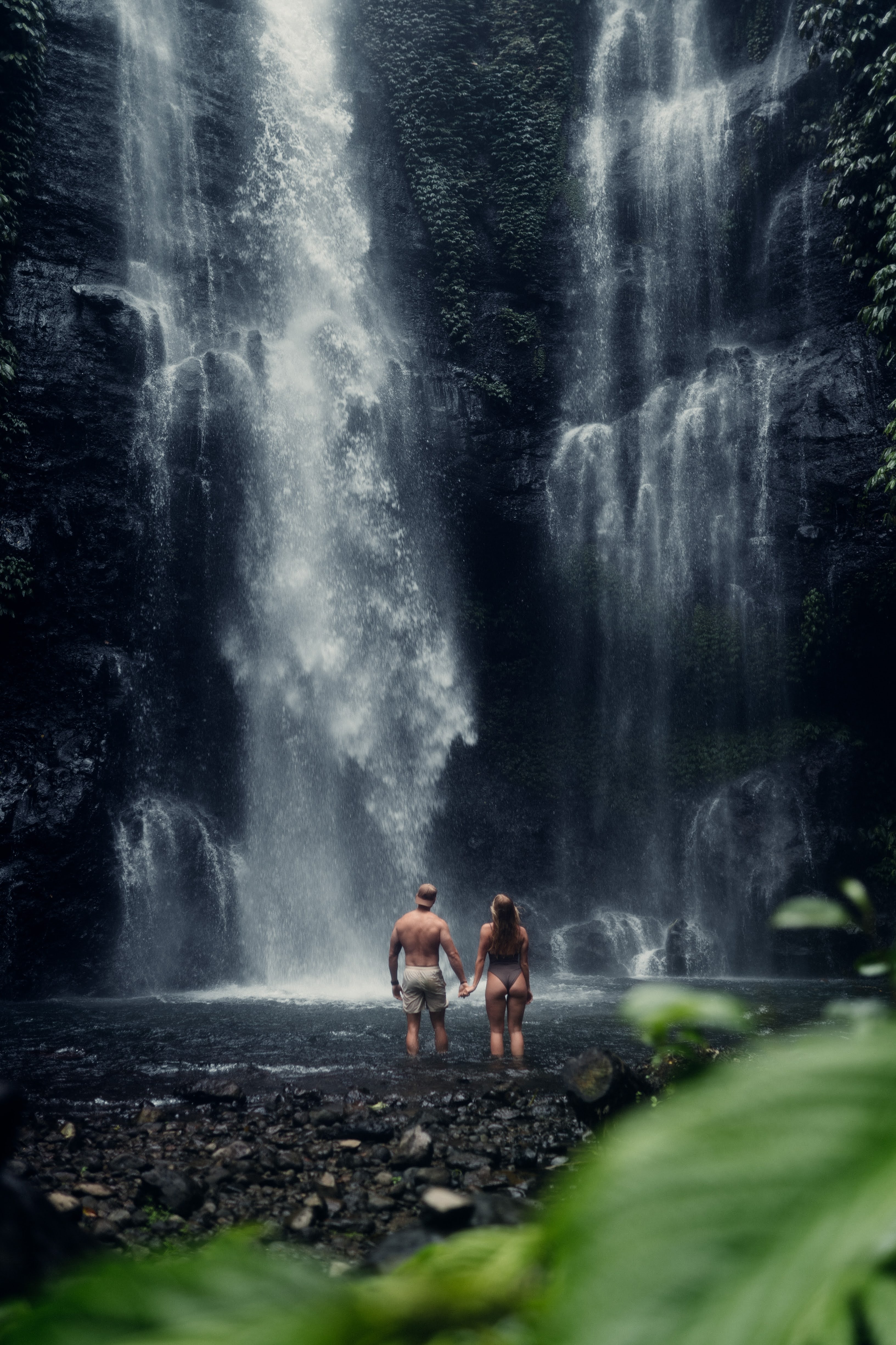 Advisor posing at a waterfall.