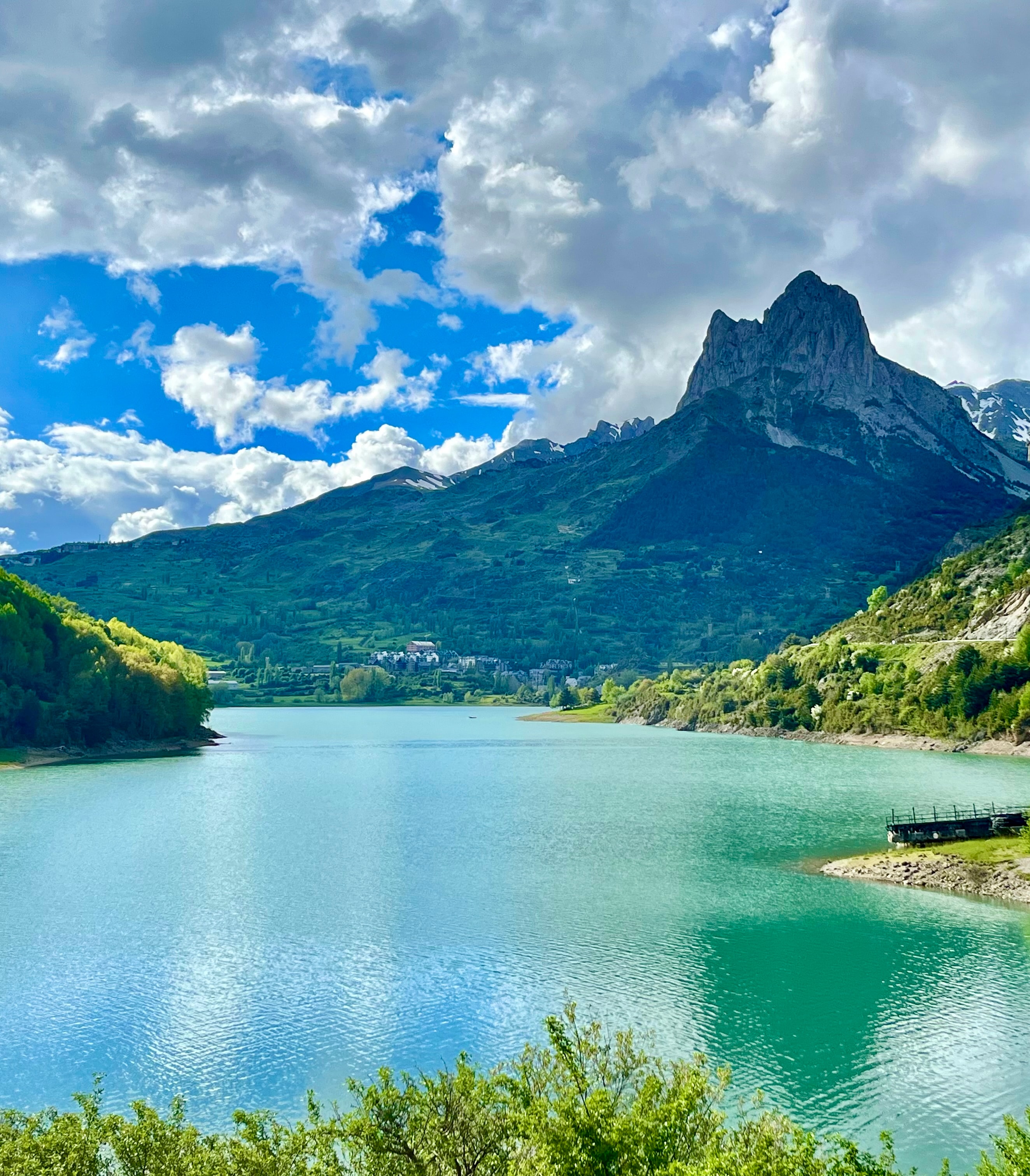 Beautiful tranquil lake surrounded by stunning mountain scenery on a sunny day