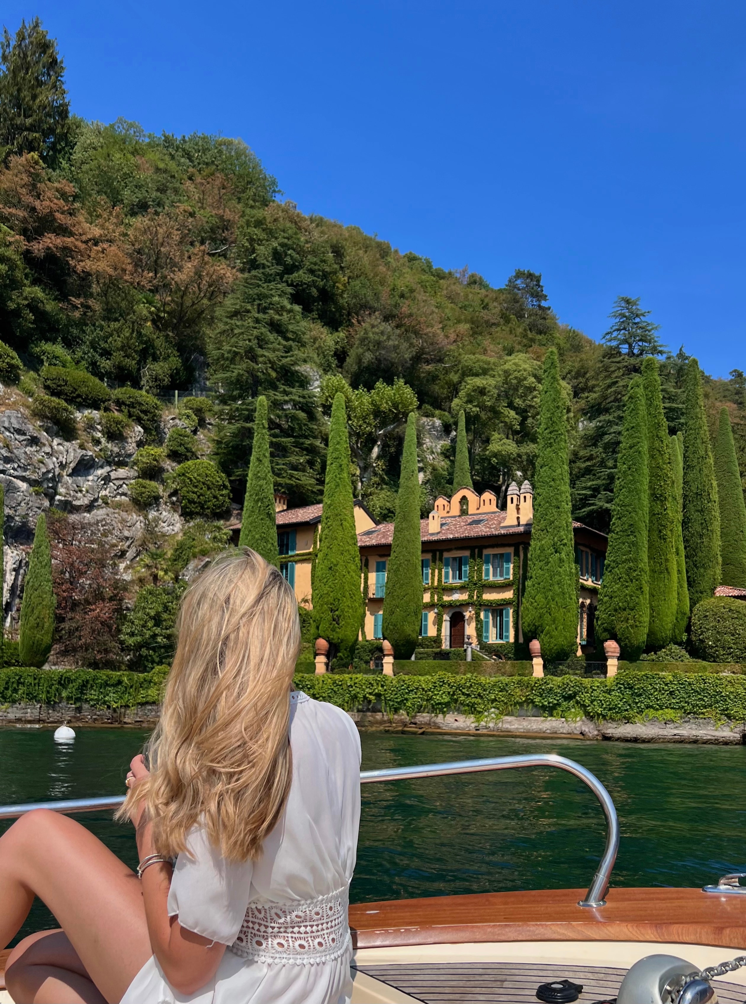 Advisor sitting on a boat on a lake in Italy on a sunny day