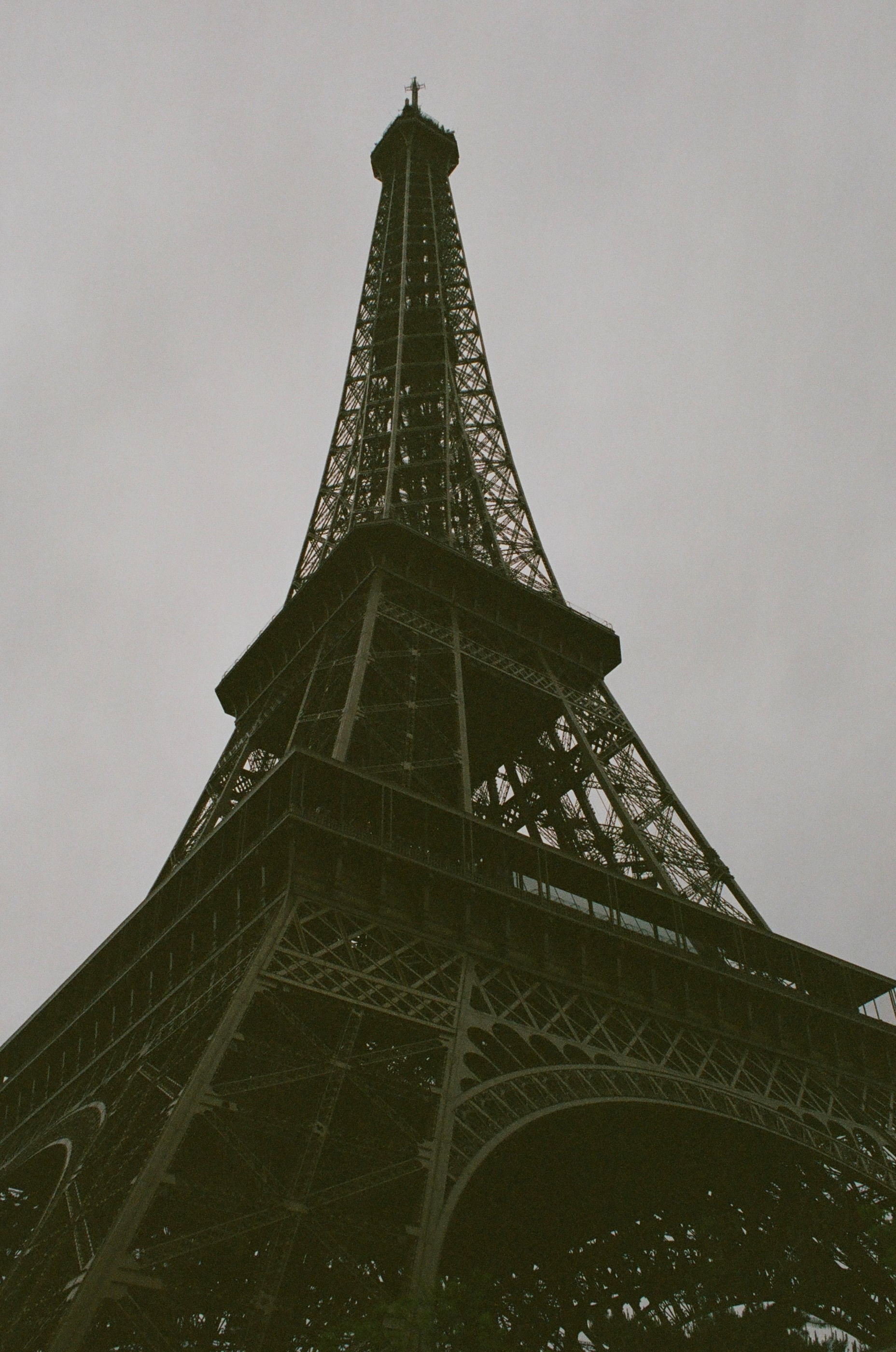 Black and white photo of the Eiffel Tower on a cloudy day