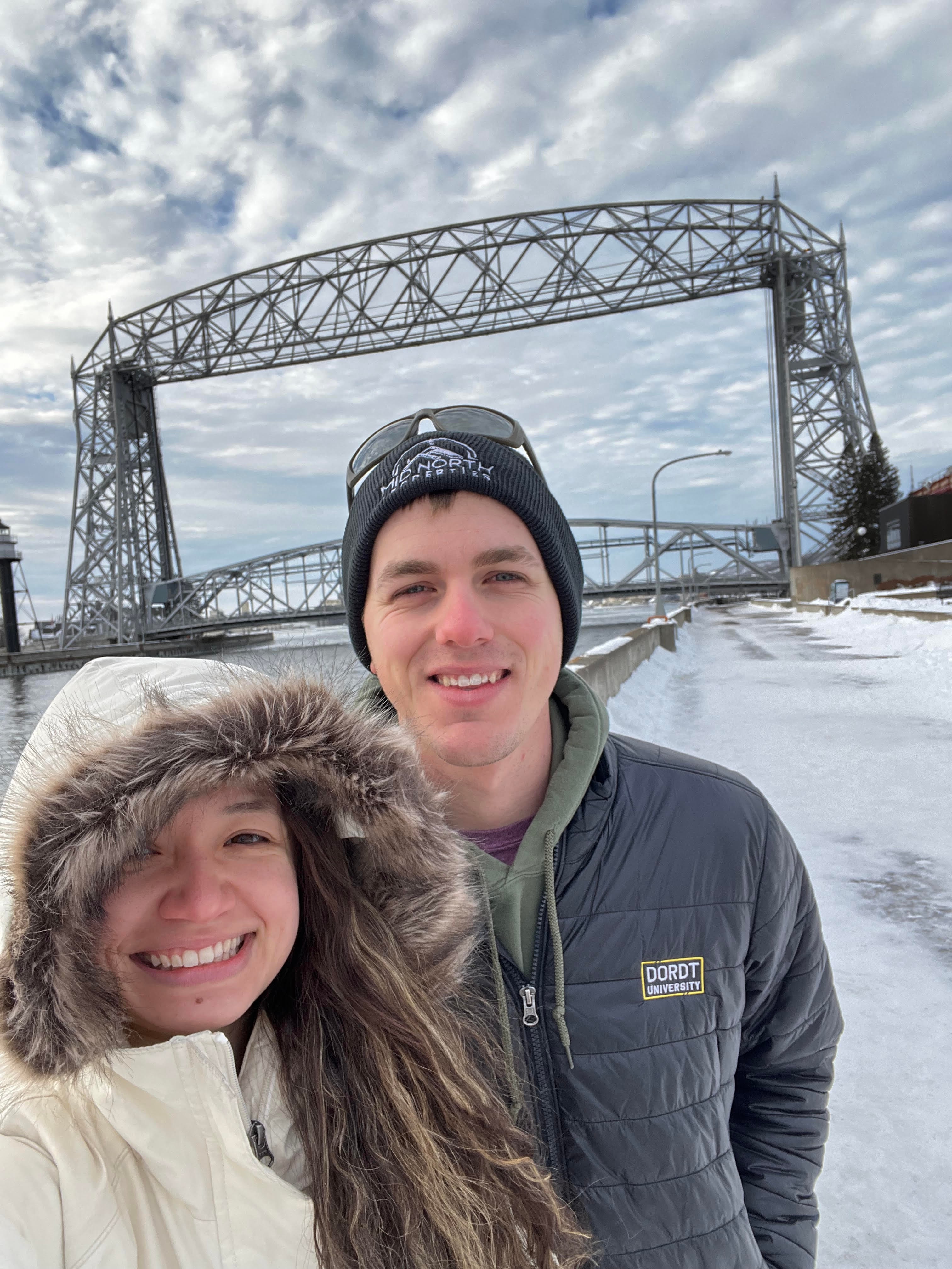 Advisor and partner taking a selfie on the side of a snowy road