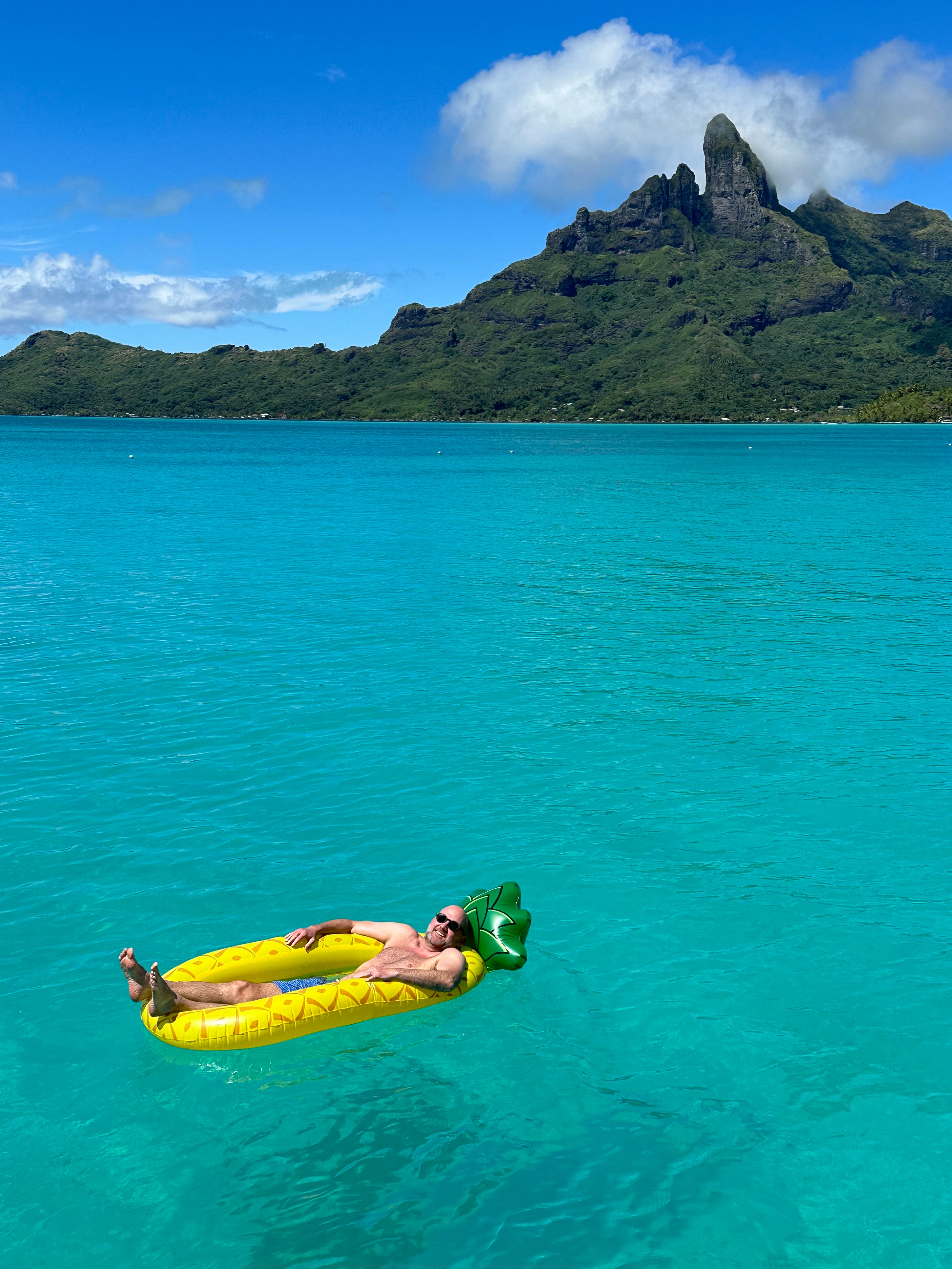 Floating in the water.