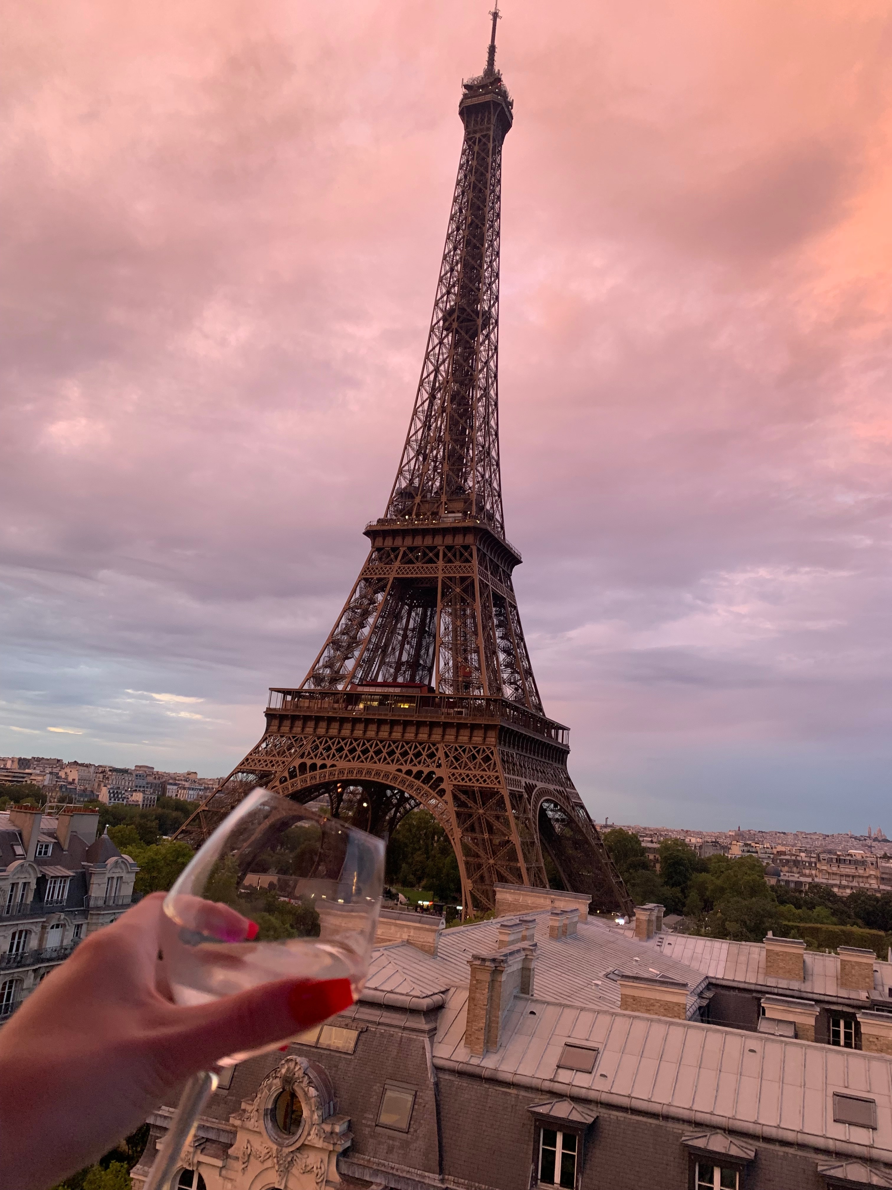 A view of the Eiffel Tower at dusk. 