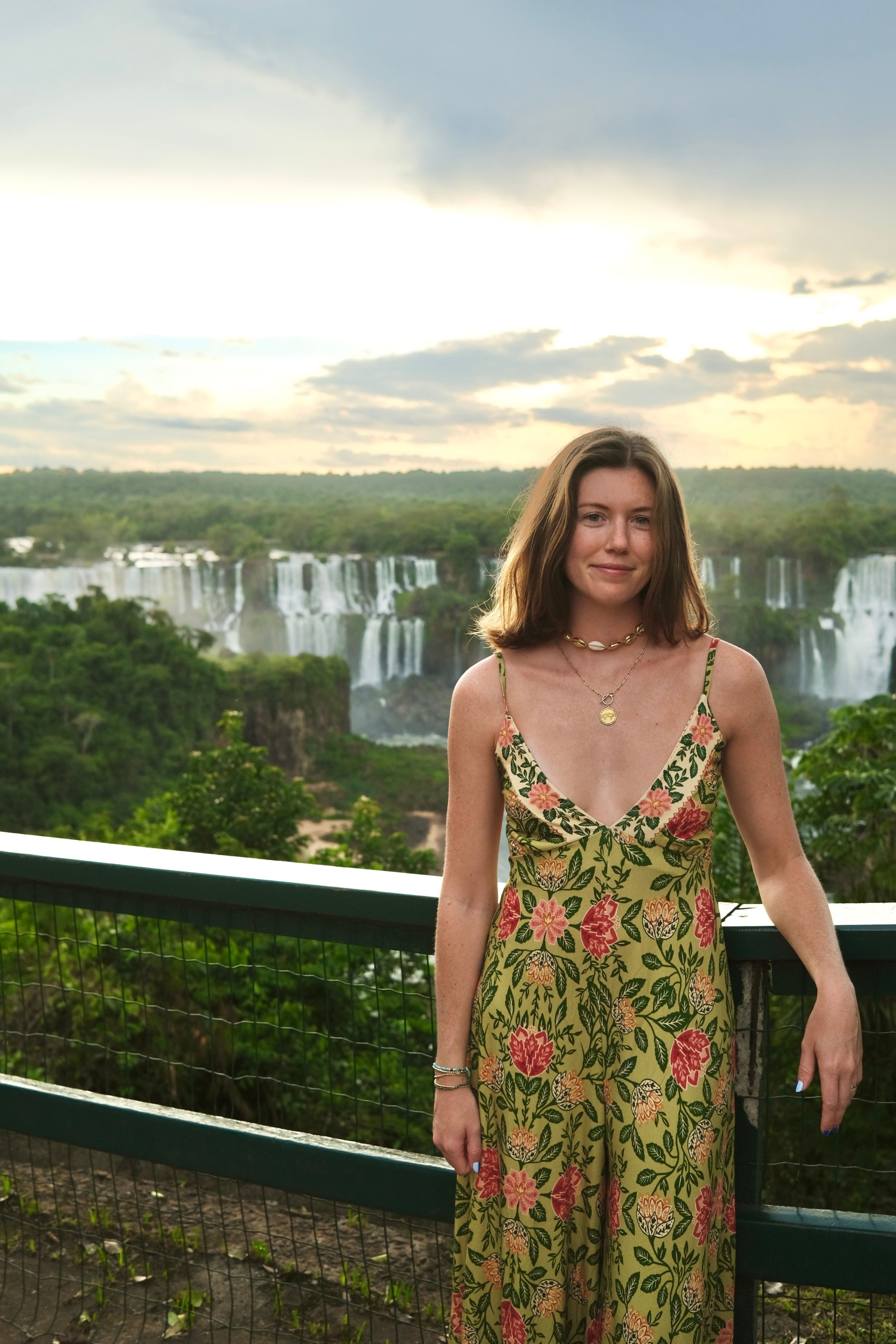 Advisor in a dress at a viewpoint overlooking Iguazu Falls