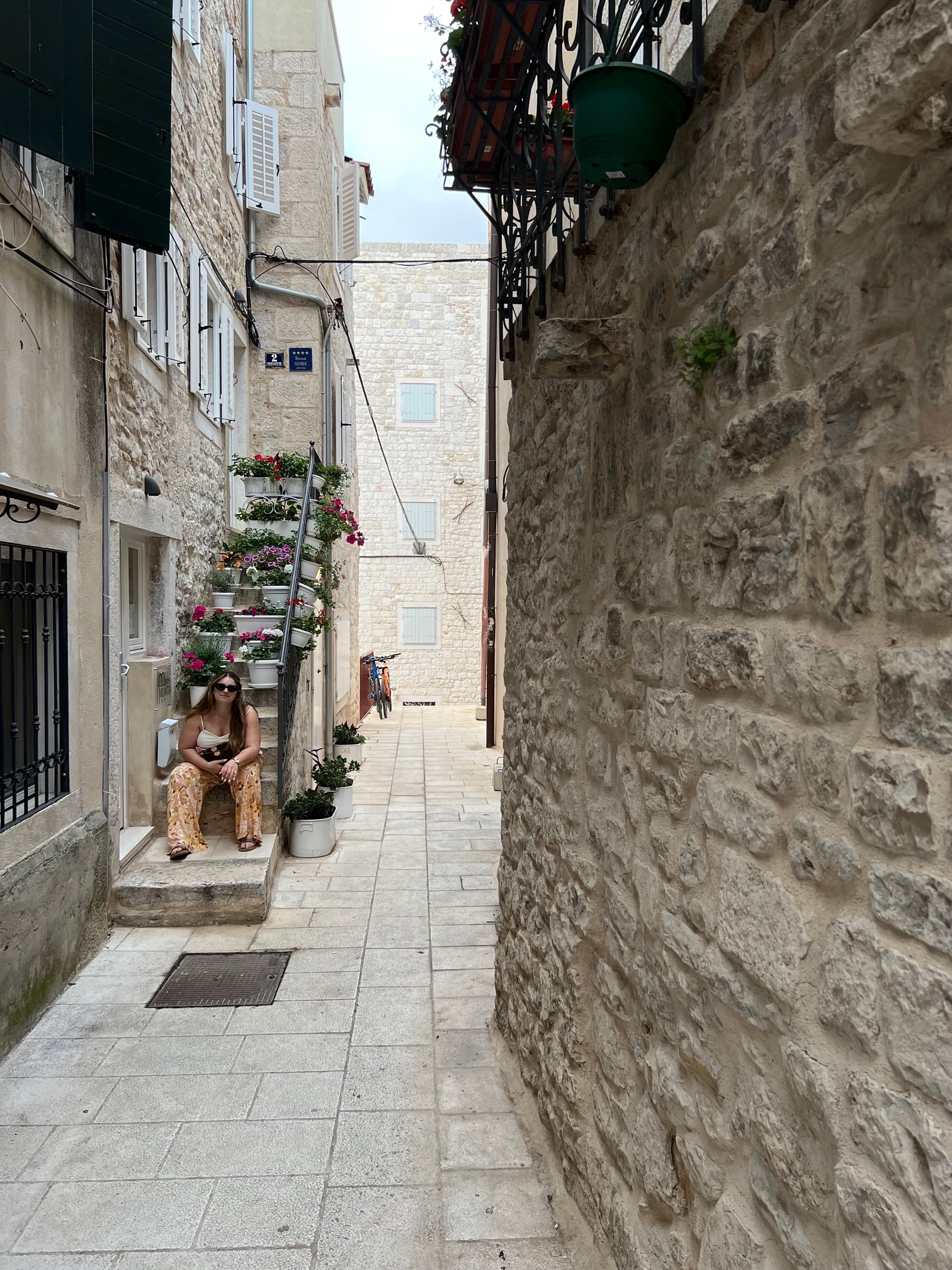 A view of a walkway during the daytime. 