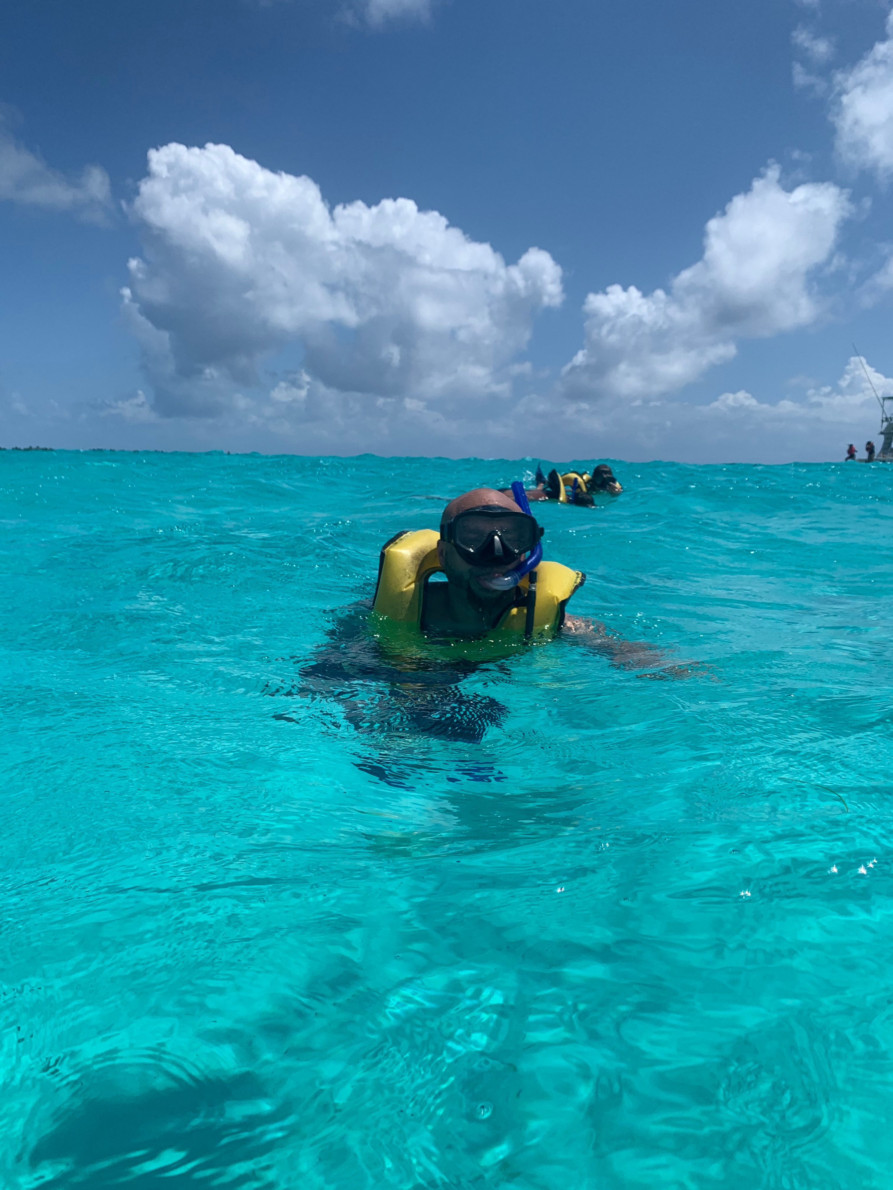 A person snorkeling in a body of water during the daytime