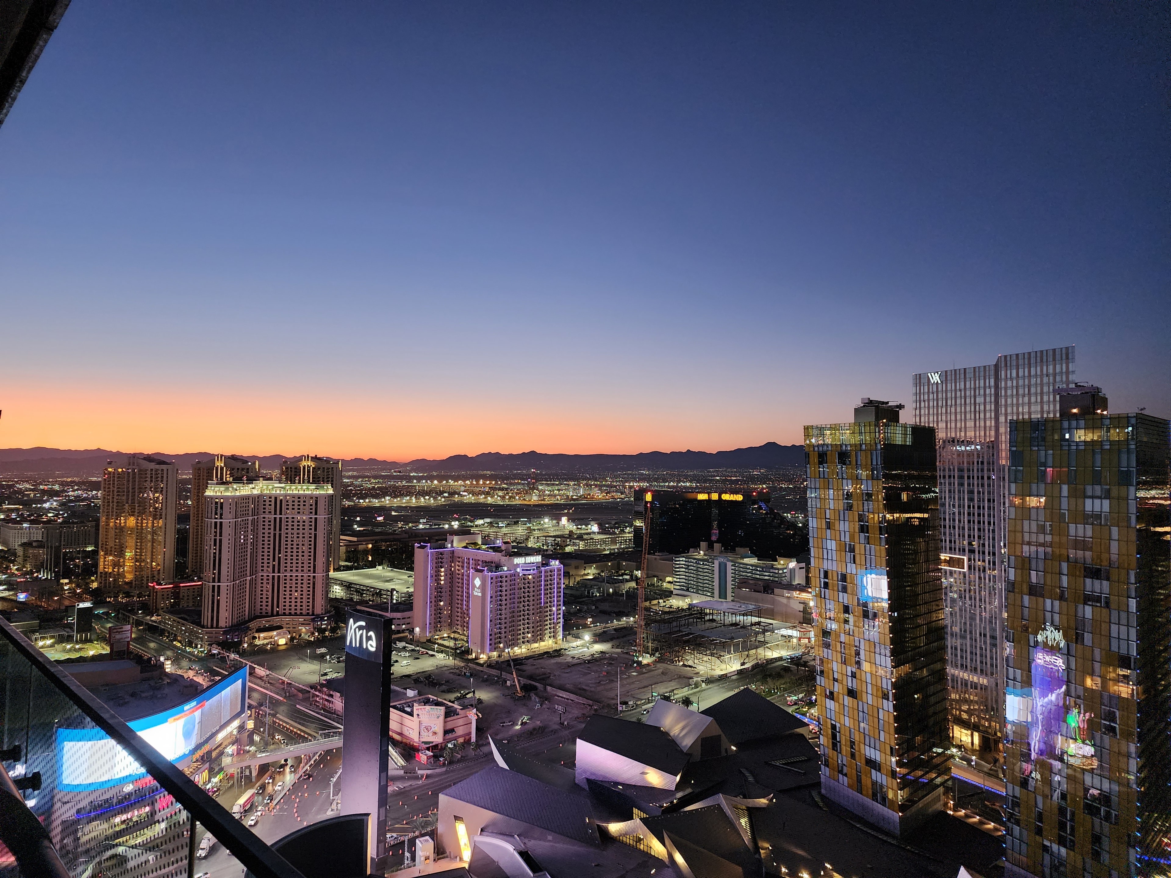 A view of a city at dusk. 