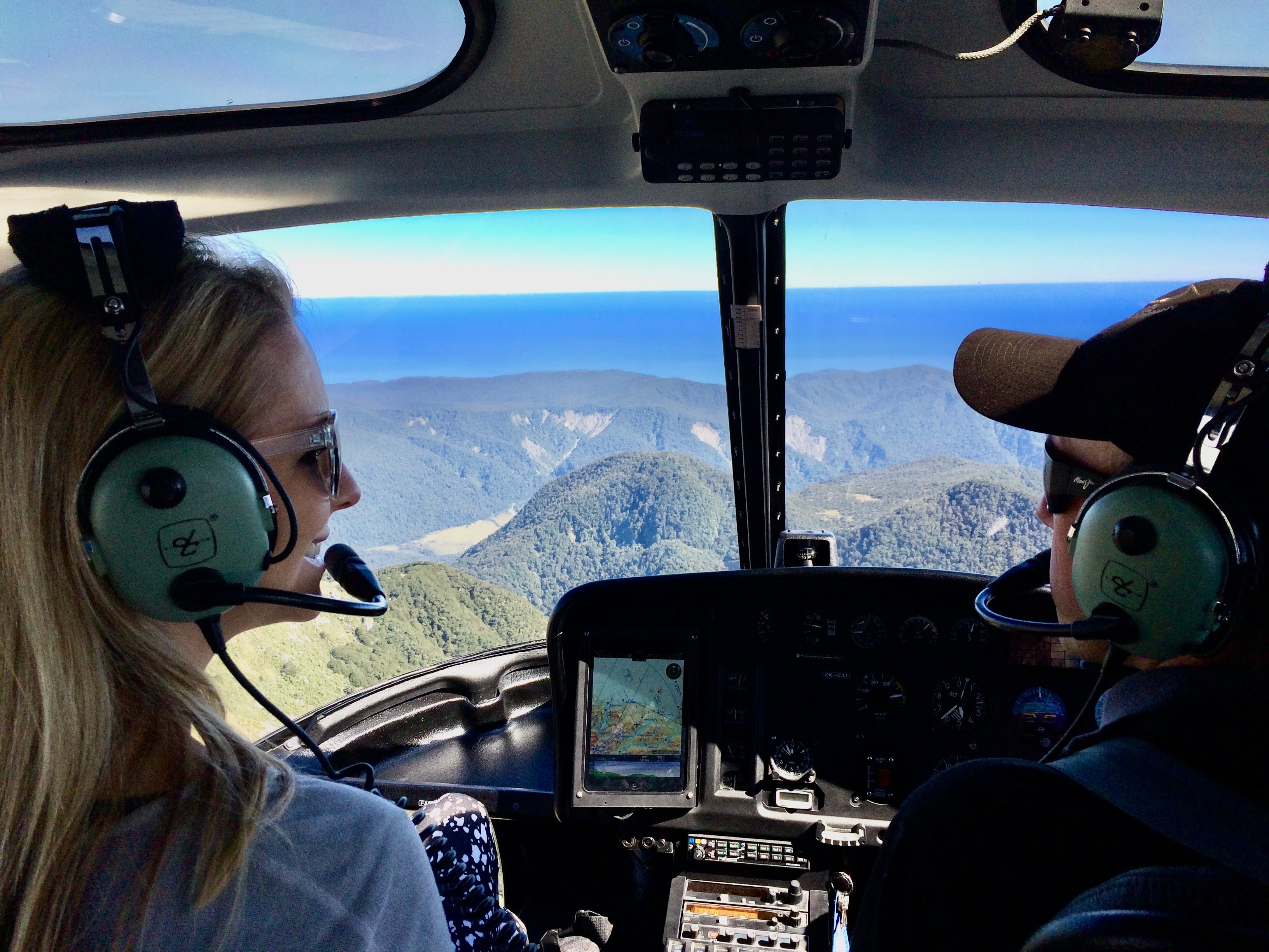 A couple flying a plane.