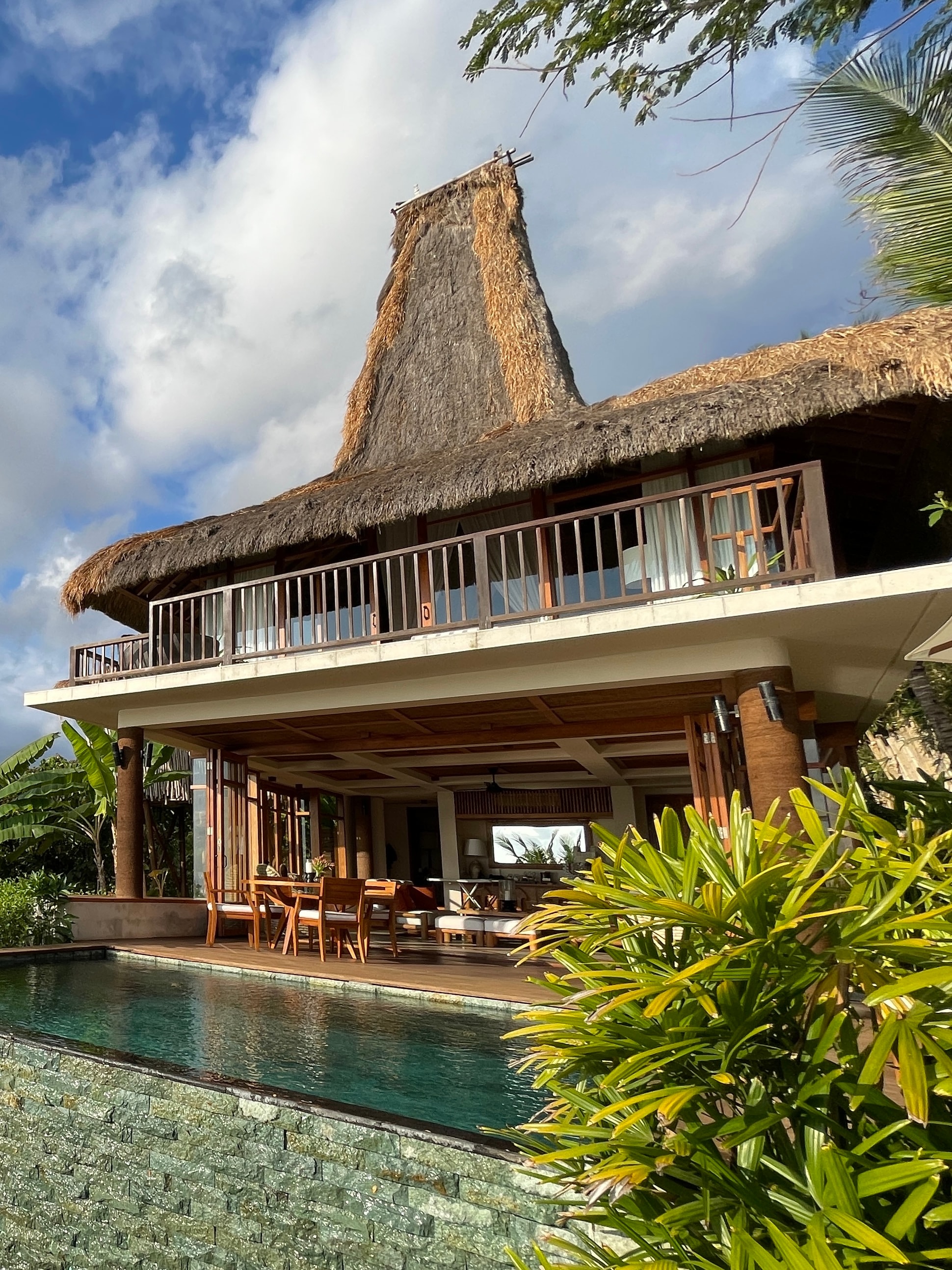 View of a beautiful private villa with swimming pool on a sunny day