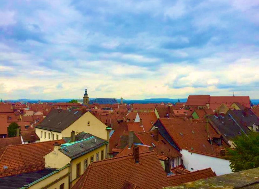 View of orange rooftops on a cloudy day in Bruges, Belgium