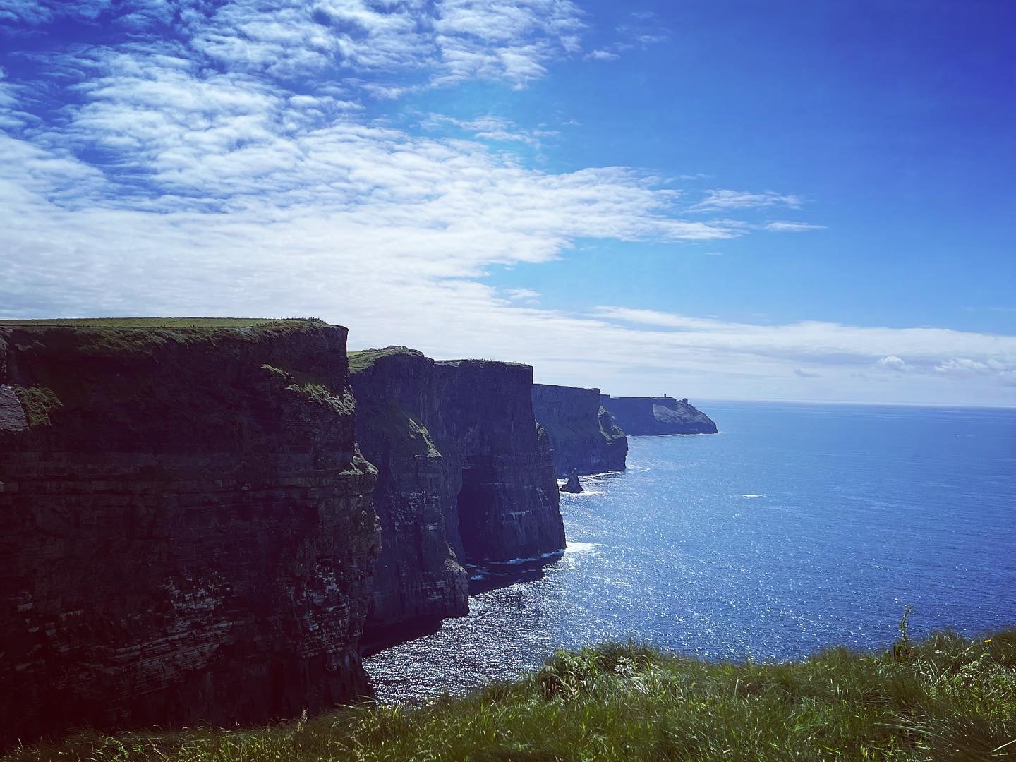 View of dramatic cliffs along the coast on a sunny day