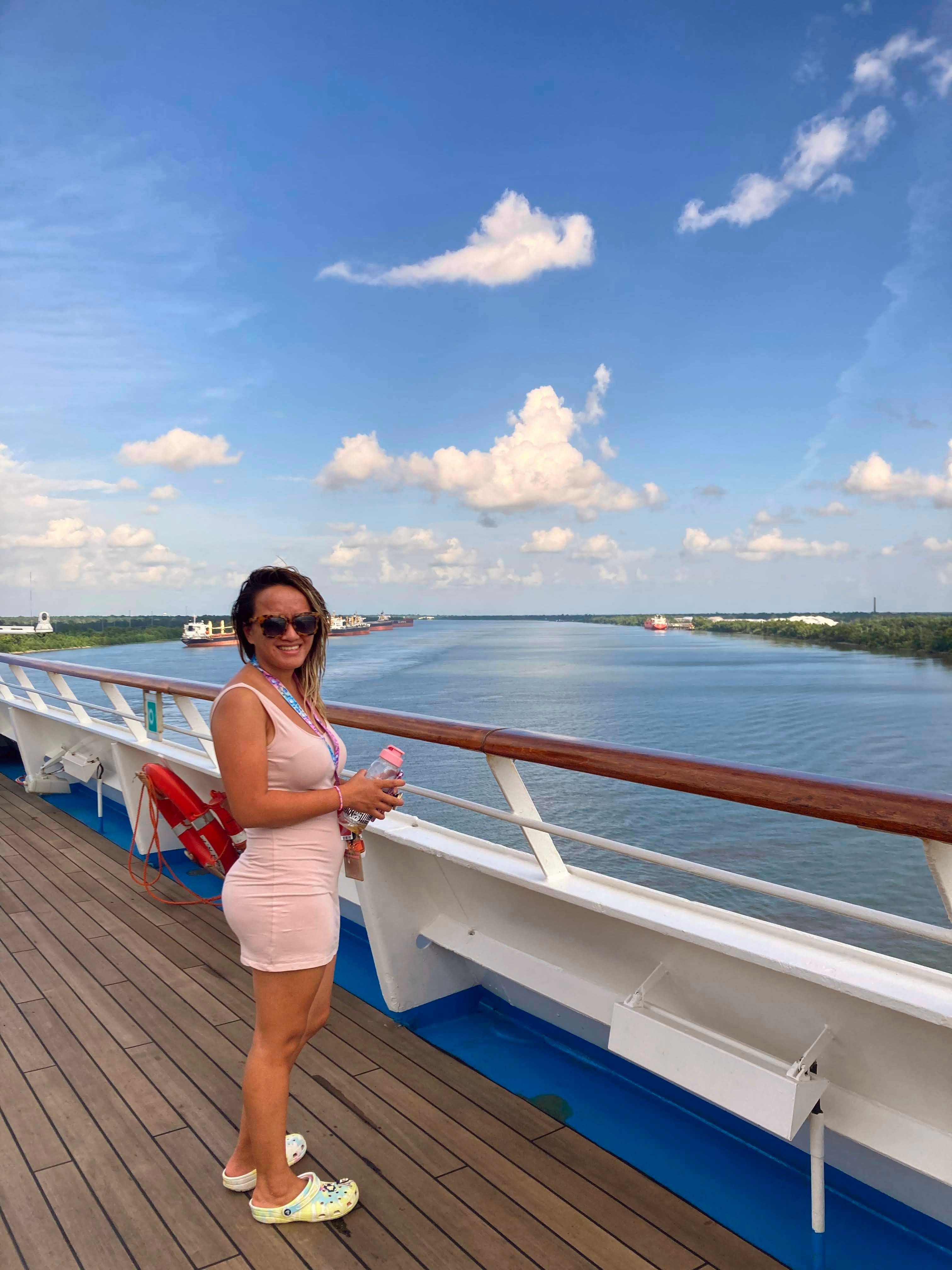 Advisor on the deck of a large ship at sea on a sunny day