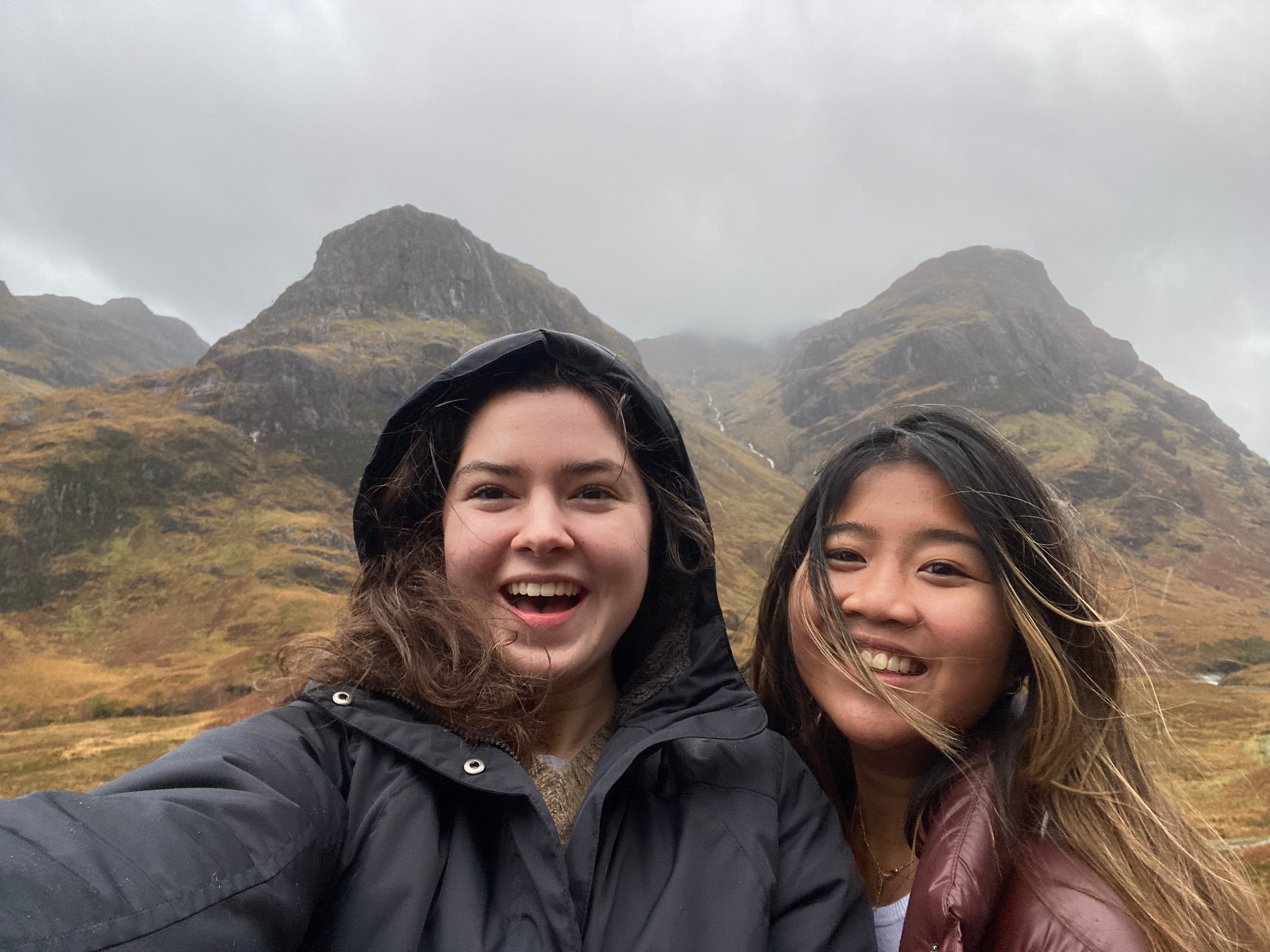 Advisor and a friend taking a selfie on a cloudy day in the Scottish Highlands