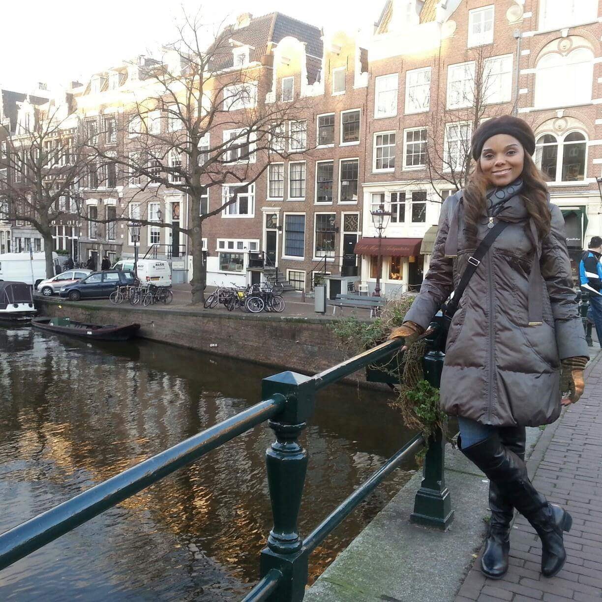 Advisor on a bridge over a canal in Amsterdam in the wintertime