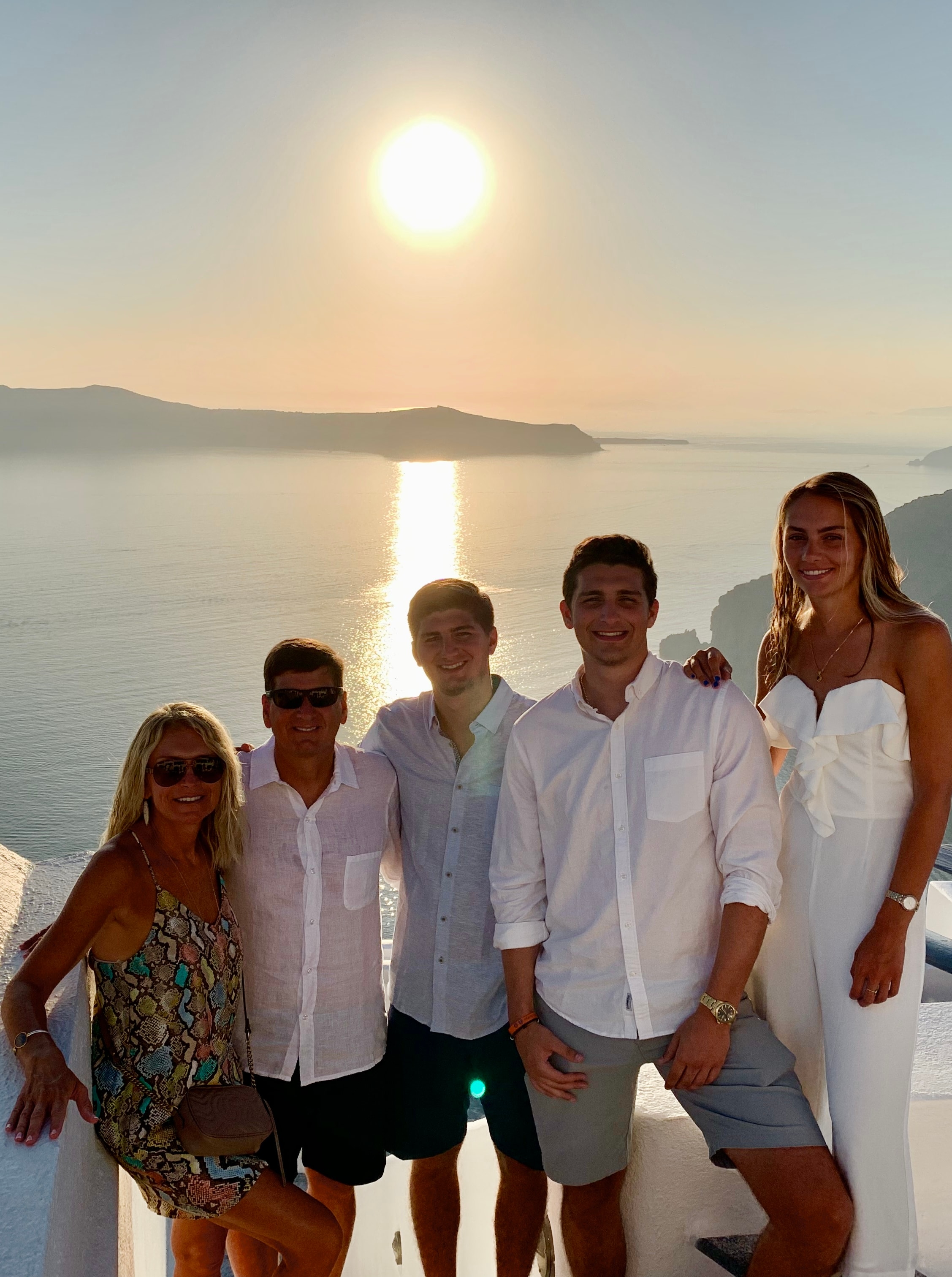 A family posing on vacation.