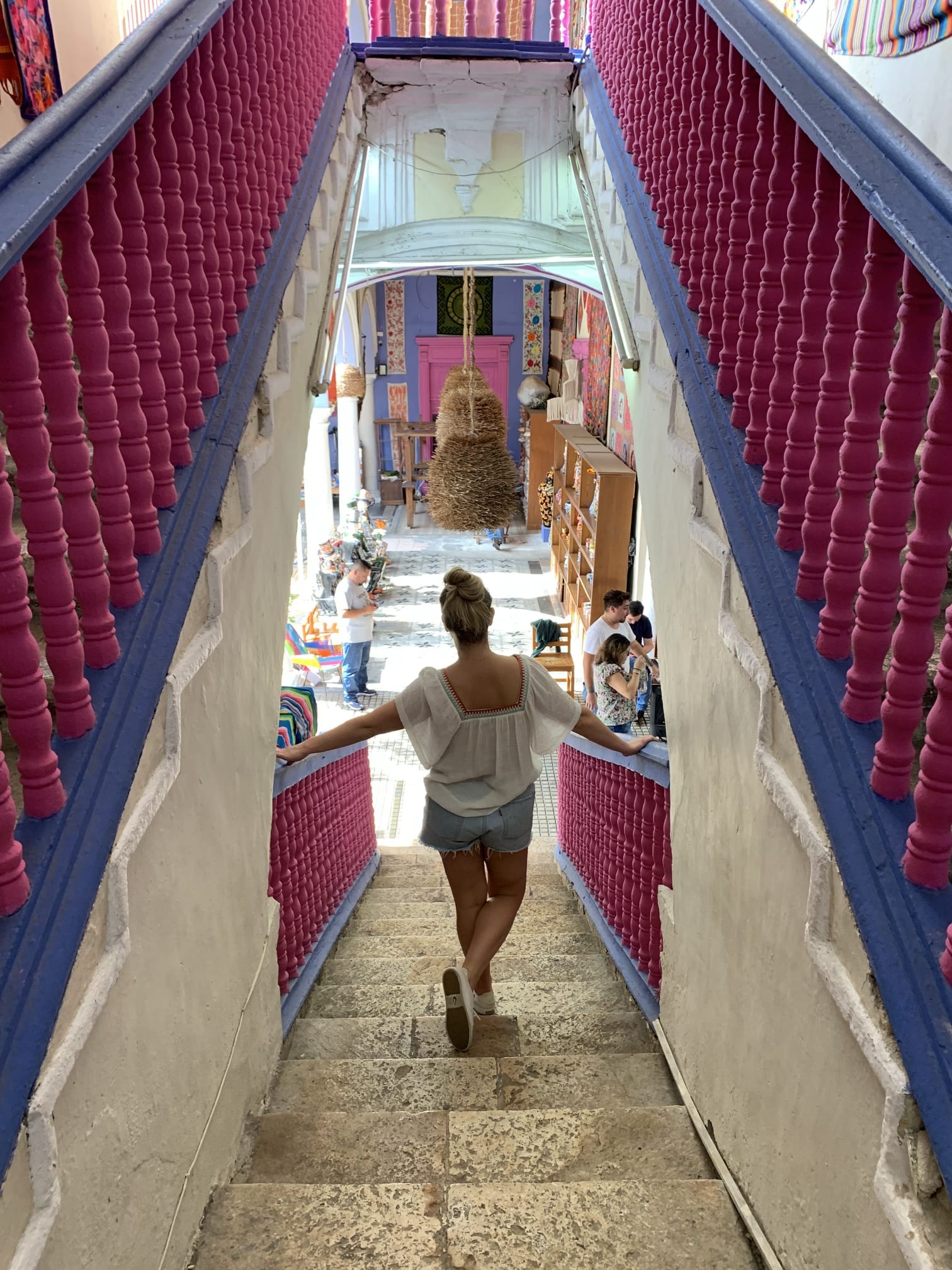 Walking down red stairs.