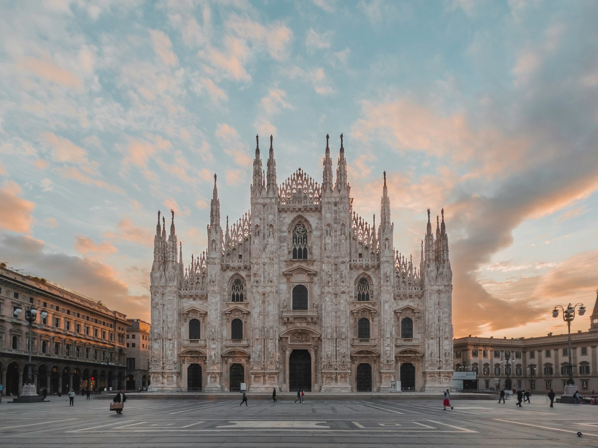 A large cathedral-like building under a sunset sky 