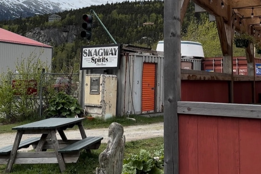 A picnic table andoutdoor bar at Skagway Spirits.