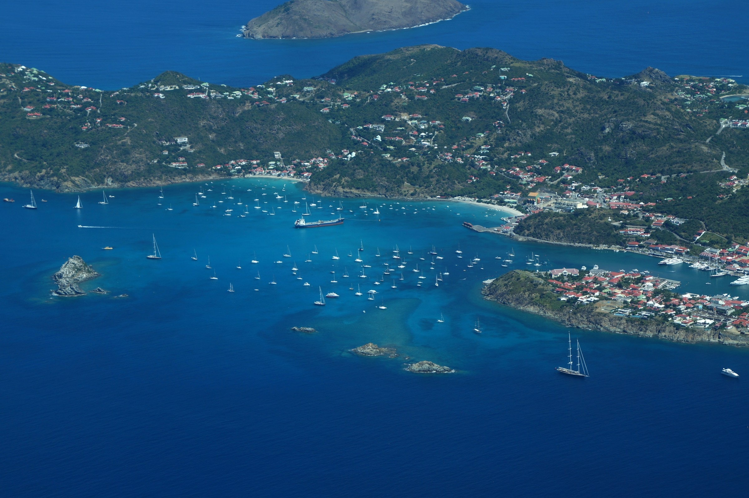 Aerial view of boats and yachts exploring the hidden coves of Saint Kitts and Nevis.