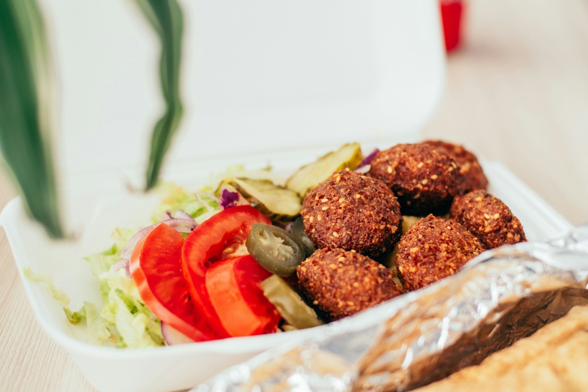 Falafel with sliced tomatoes.