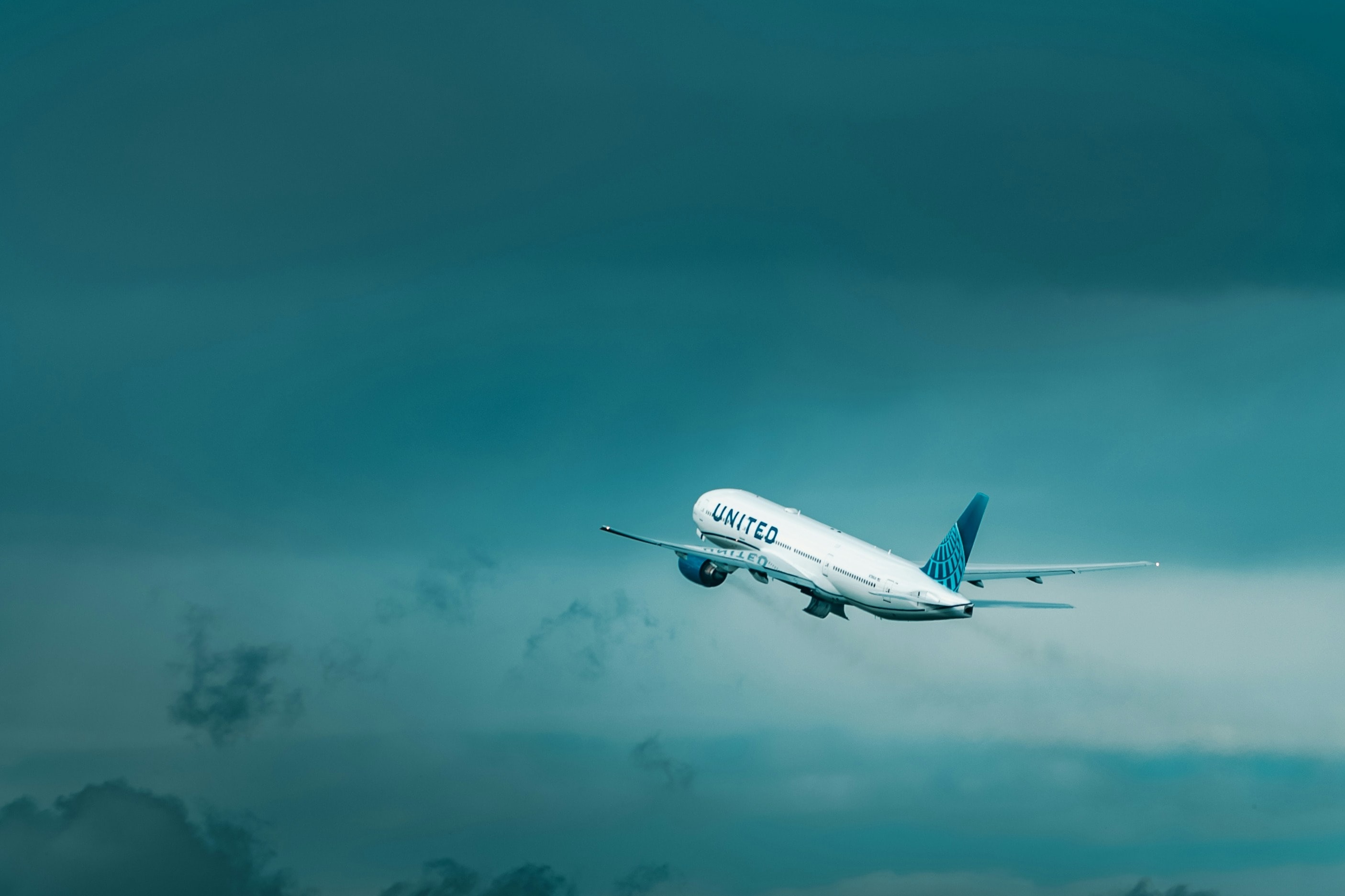 A picture of an airplane taking off during evening time.