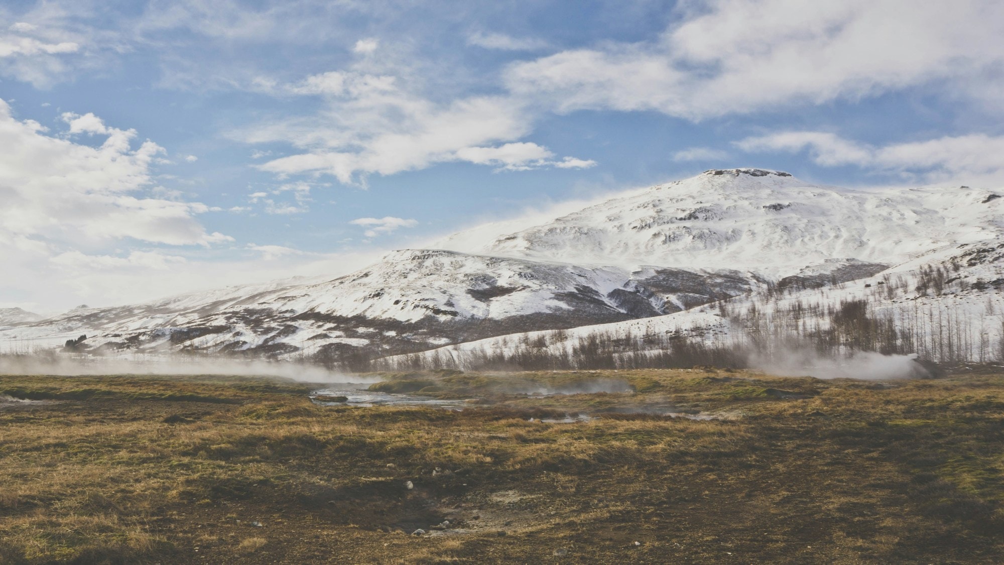 Snow covered mountains during the daytime