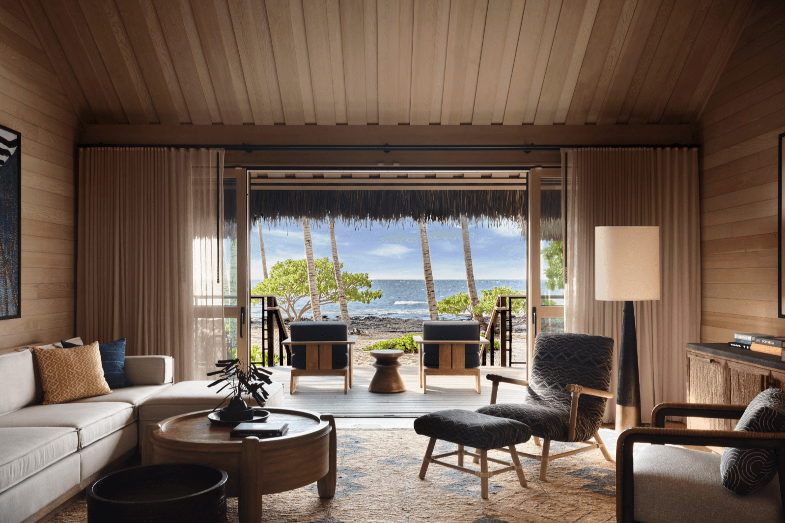 a handsome open-air living room overlooking a tropical paradise