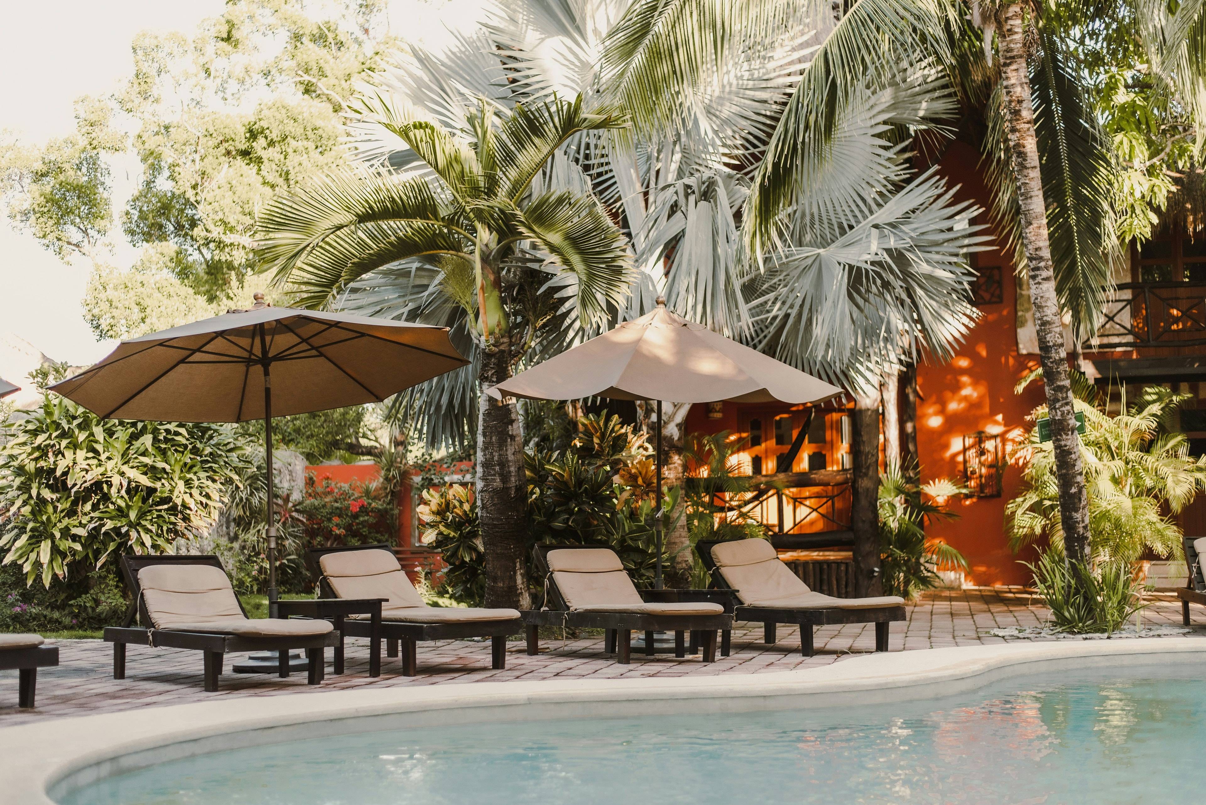 A picture of the poolside of a resort during daytime