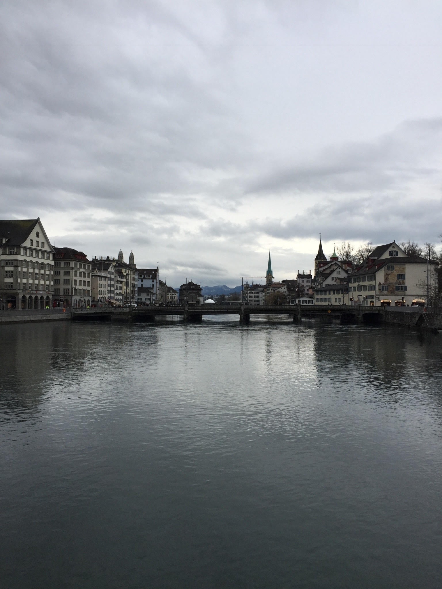 Beautiful view of a lake in Zurich with surrounding buildings