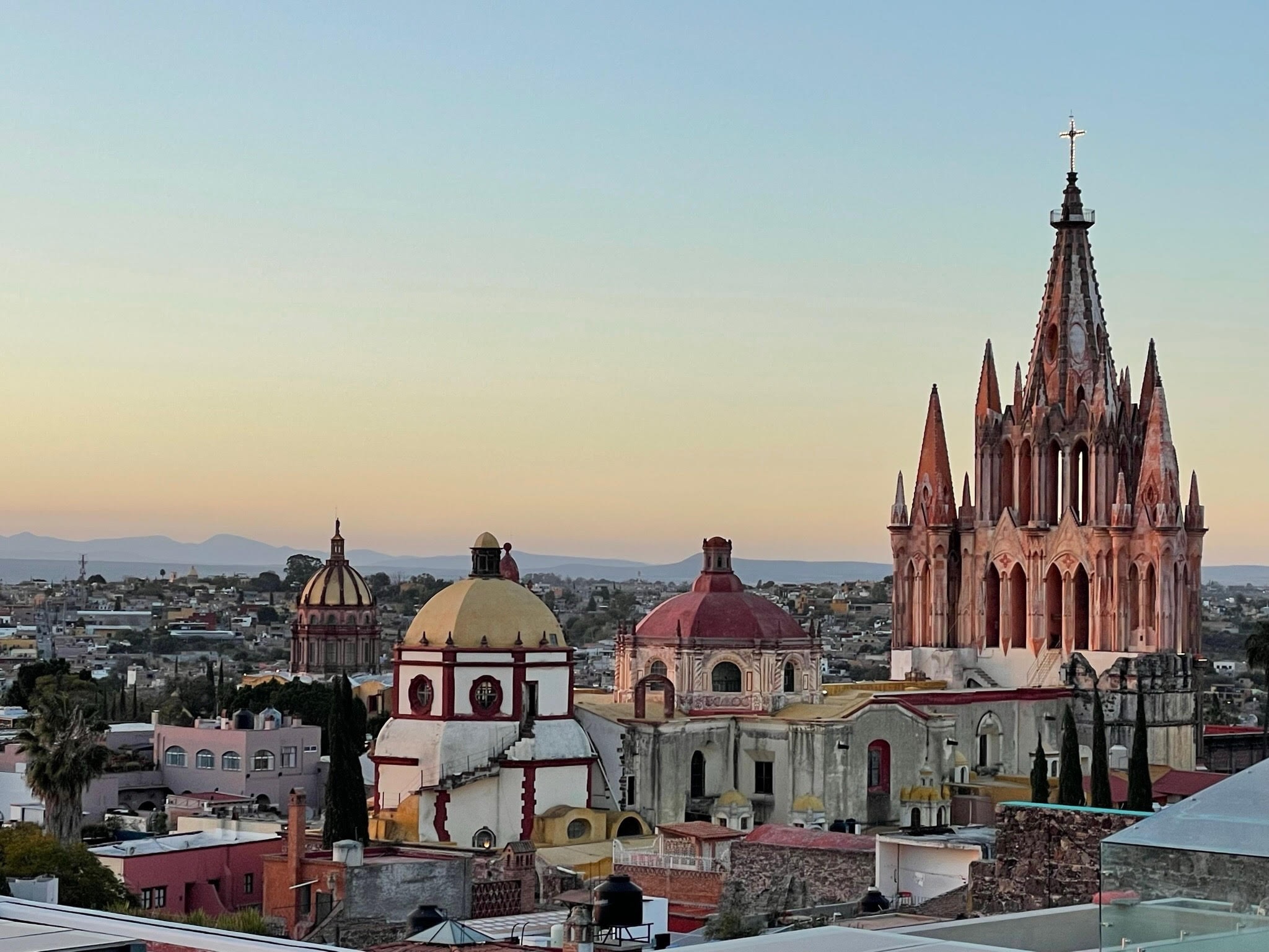 View of Parroquia de San Miguel Arcángel Church from above with dome-shaped picturesque buildings