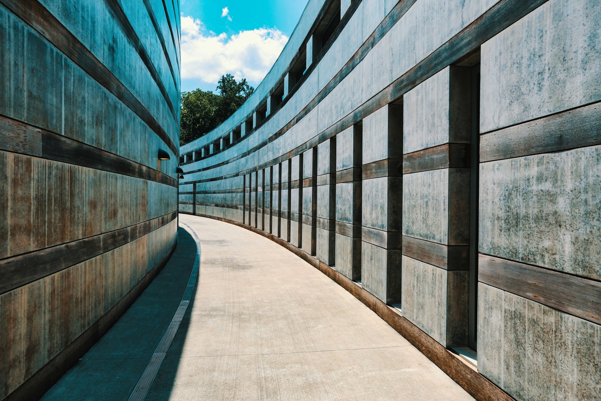 A curved empty outdoor alley.